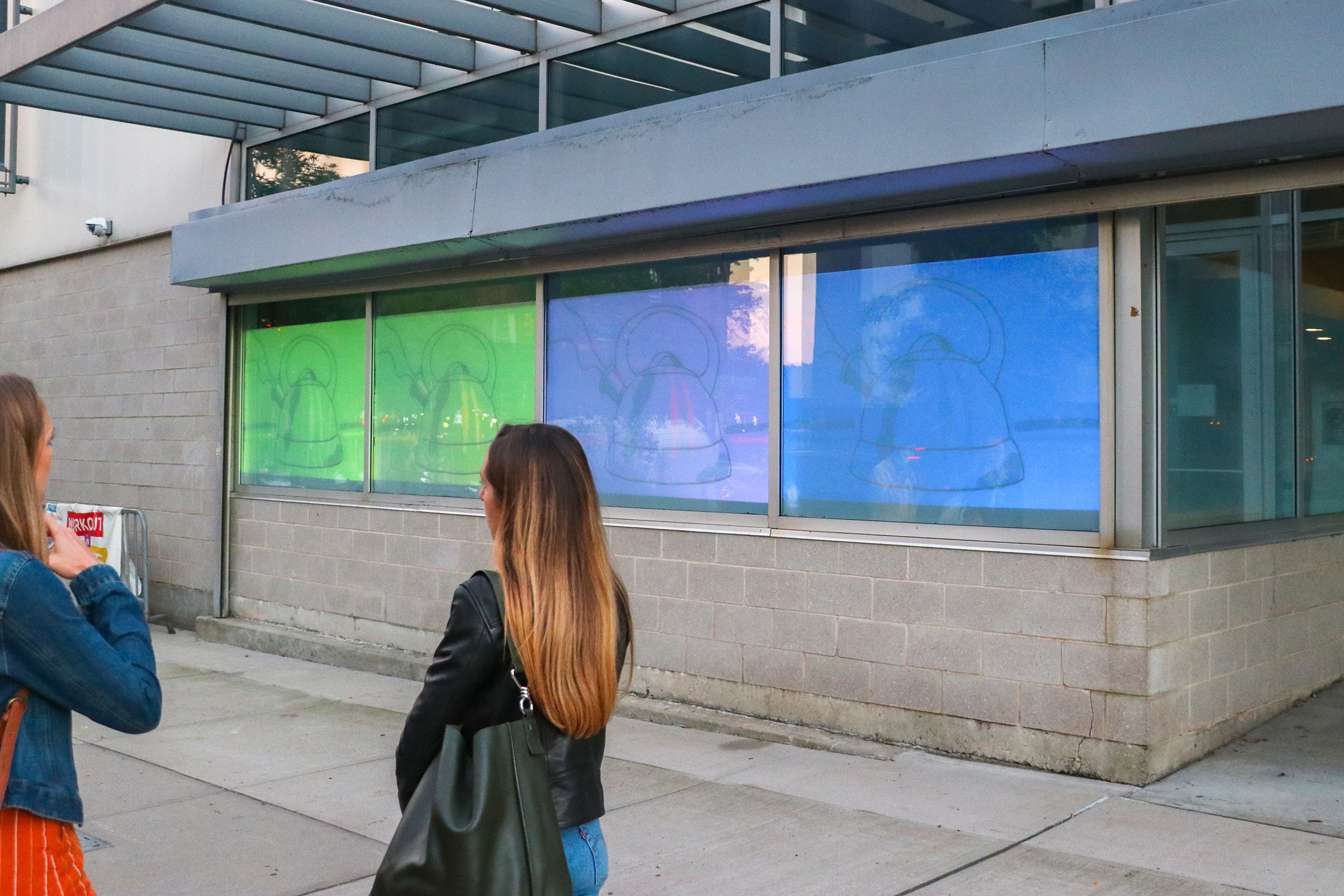 “Tea Time” by Amelia Johnson in the Film/Video Building windows (photo by Deniz Gonel)