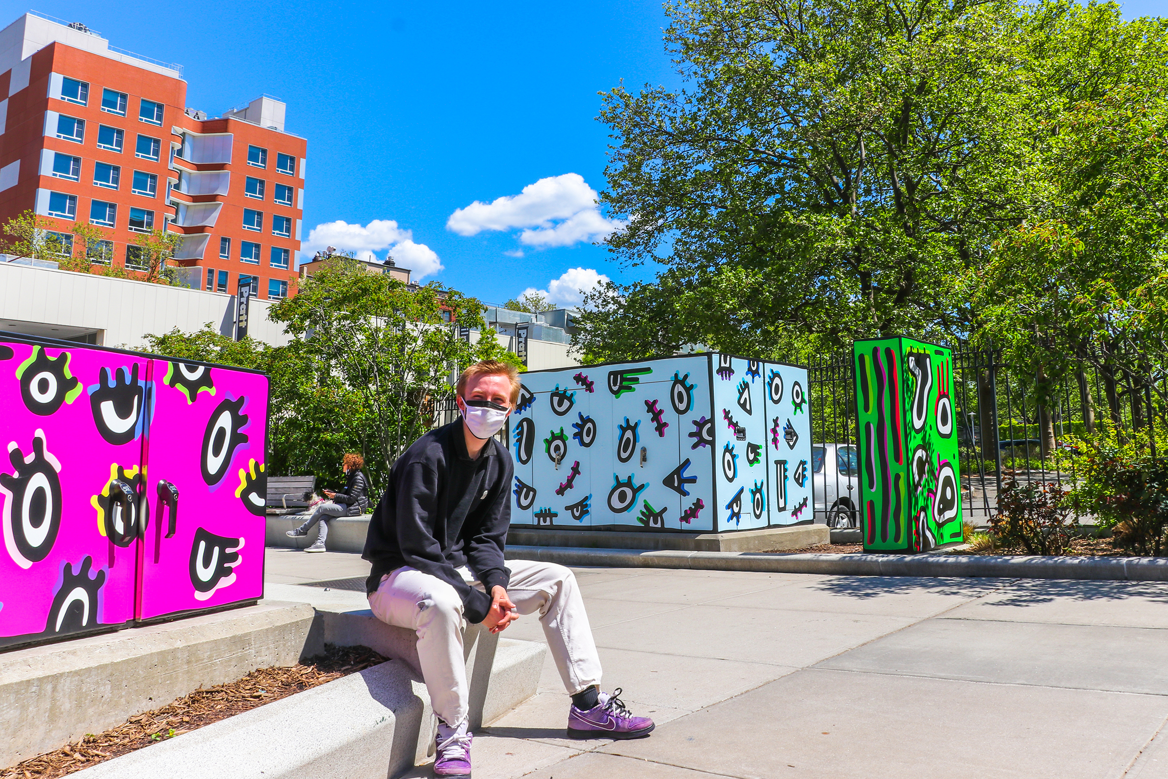 Jack Ketteler, BFA Communications Design (Illustration) ’23, with his “Watching” installation (photo by Deniz Gonel)