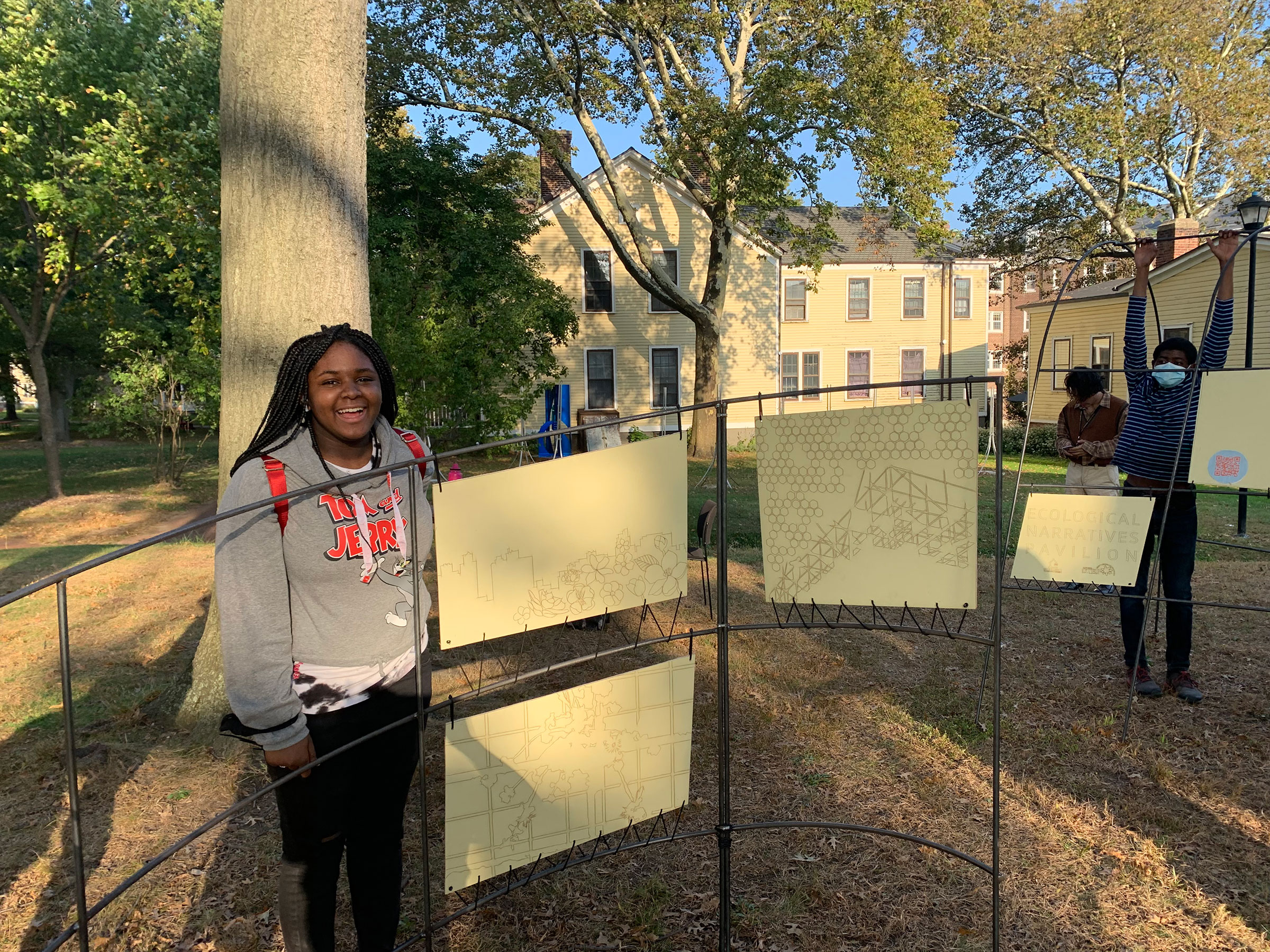 High school student Karissa with the Urban Ecology Pavilion on Governors Island
