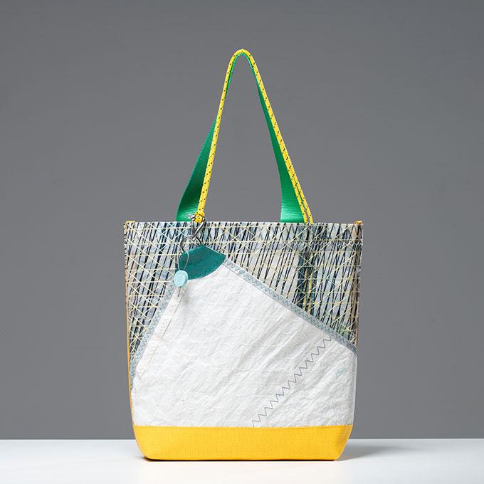 Tote bag with color blocks of white, yellow, and gray