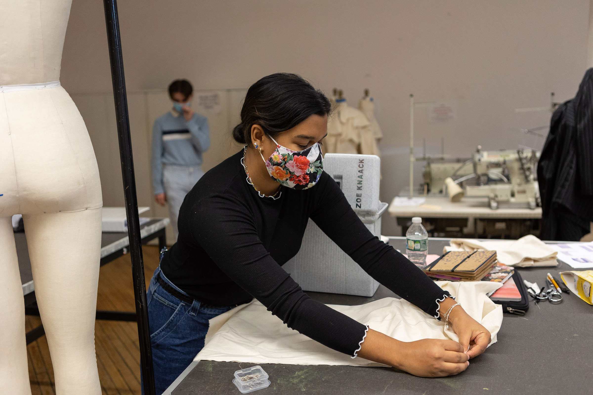 Student working on drapery and construction in 2021