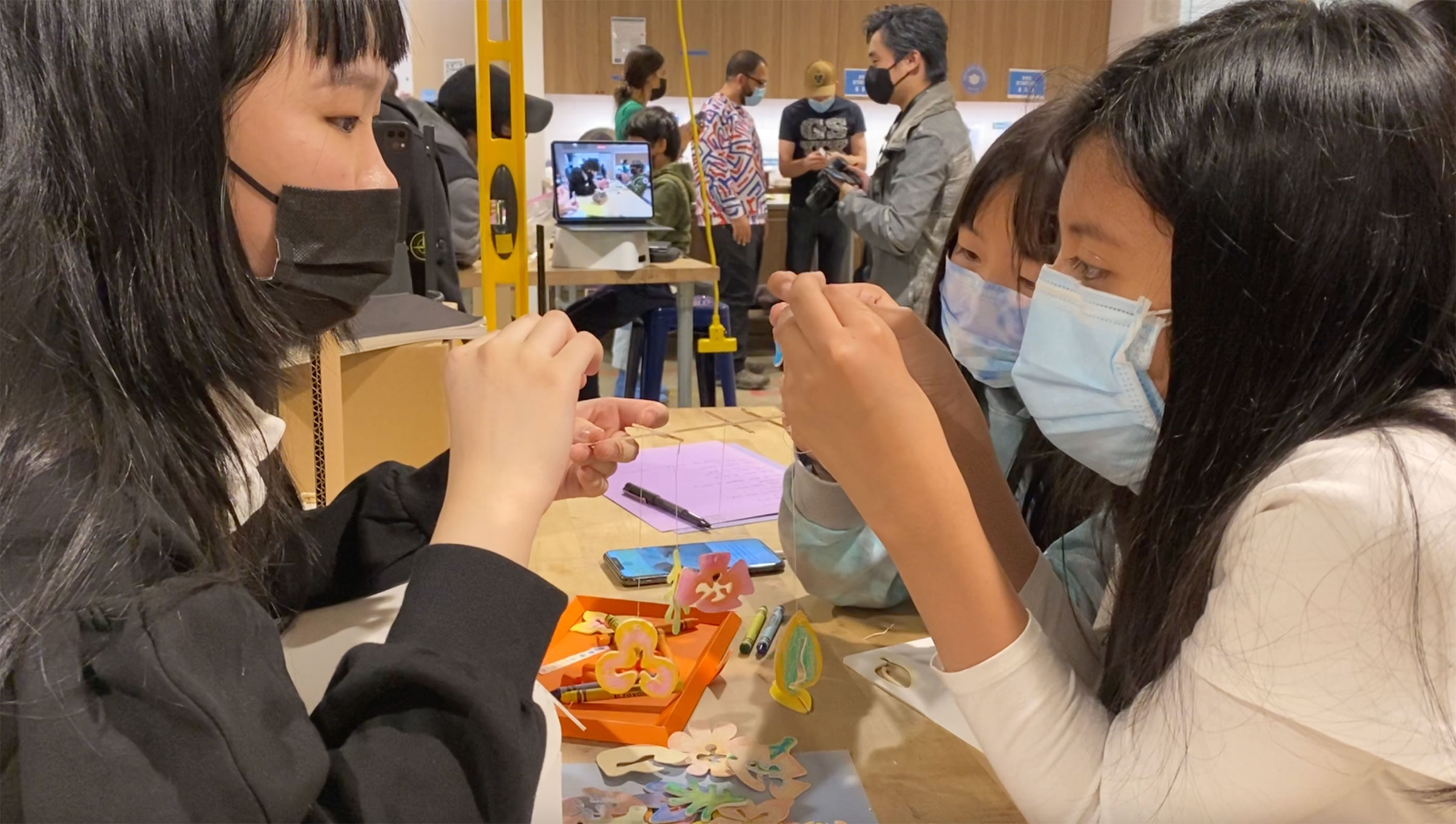 Thyan Zou, BID ’22, sharing her project with students at NYC FIRST