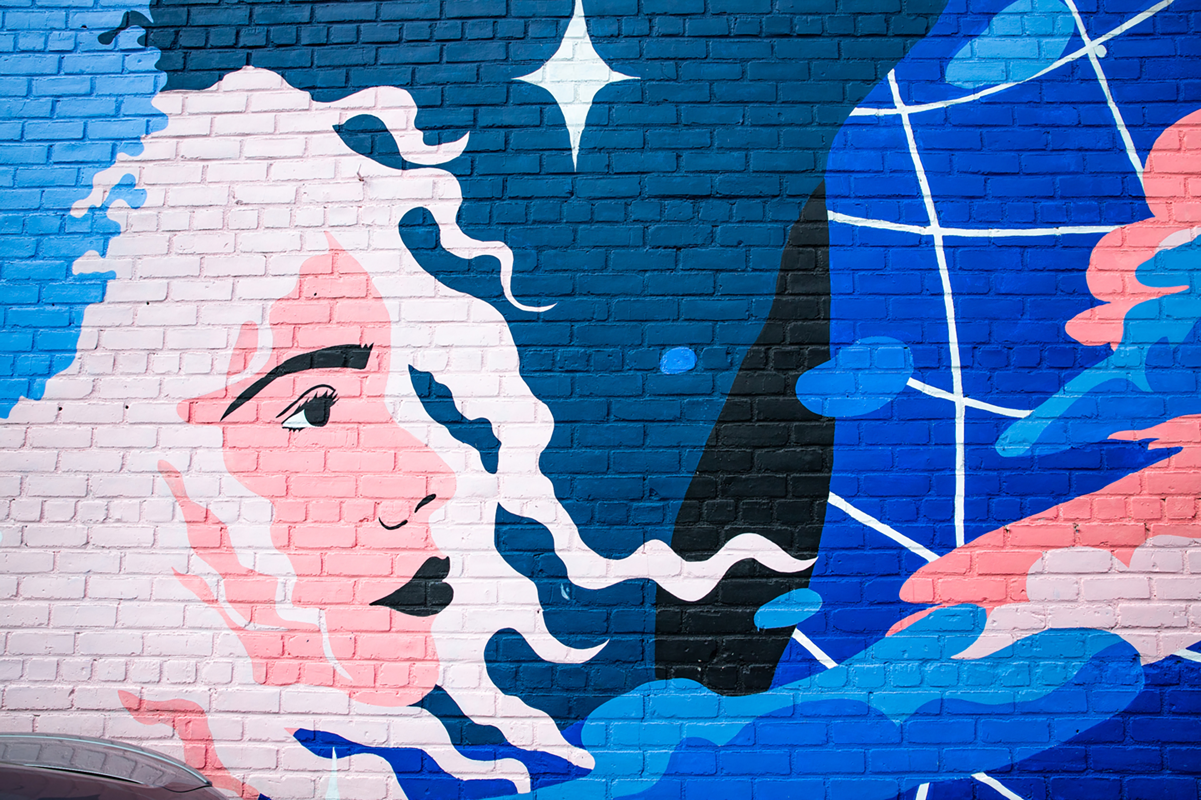 Portrait of a woman in profile with flowing white hair and star above her head