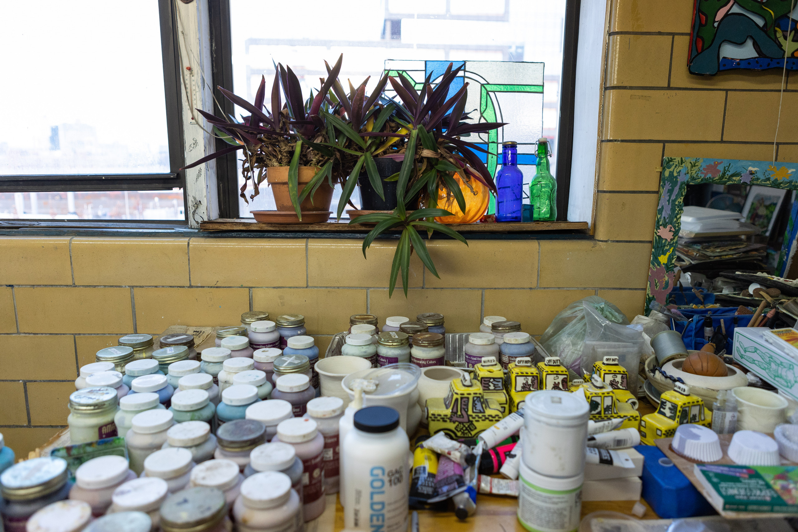 Shelves of materials and supplies at Noël Copeland's Navy Yard studio
