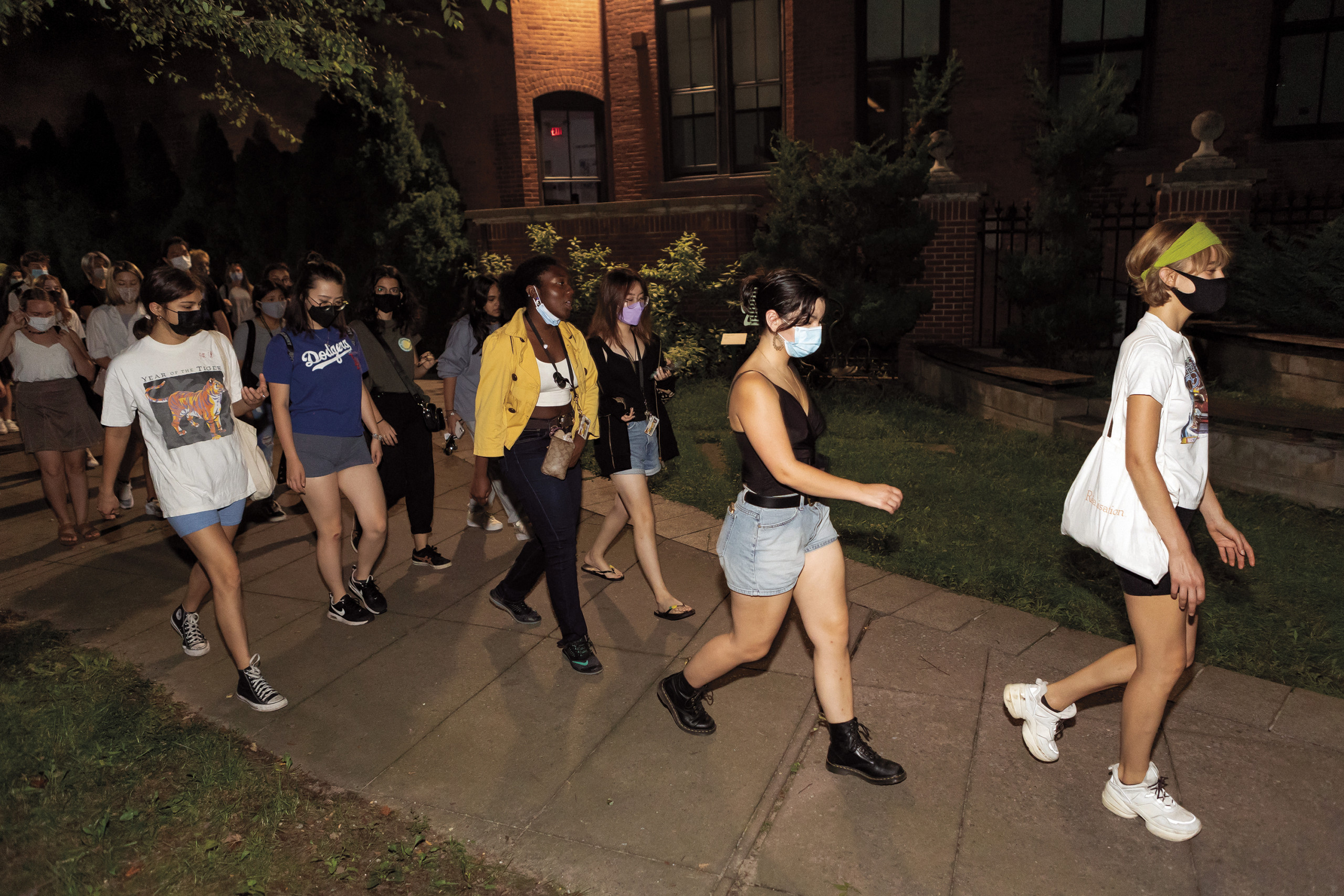 Students walk together on the Brooklyn campus before dawn