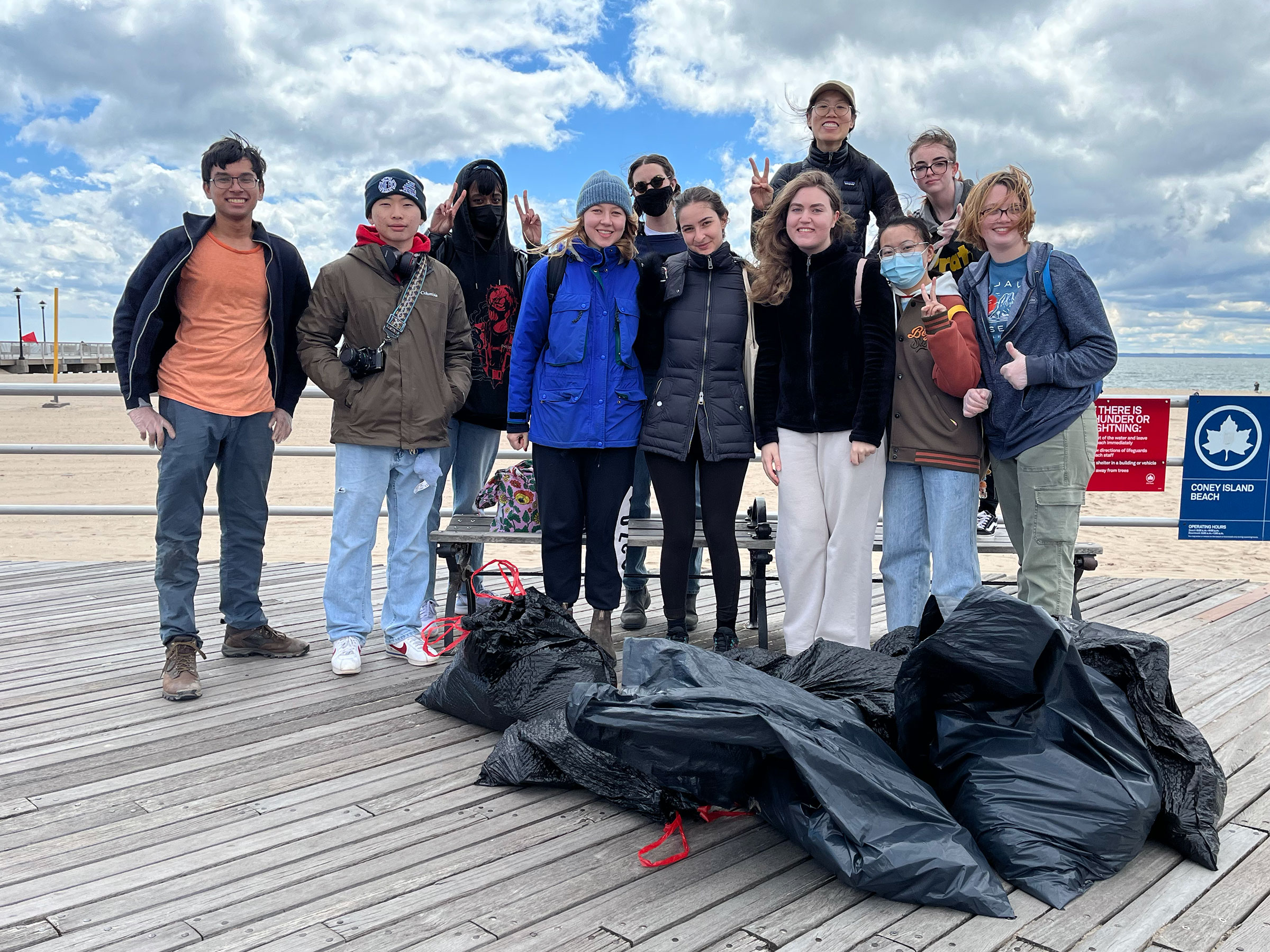 The beach cleanup participants and the trash they removed from Coney Island (photo by Sangjin Park)