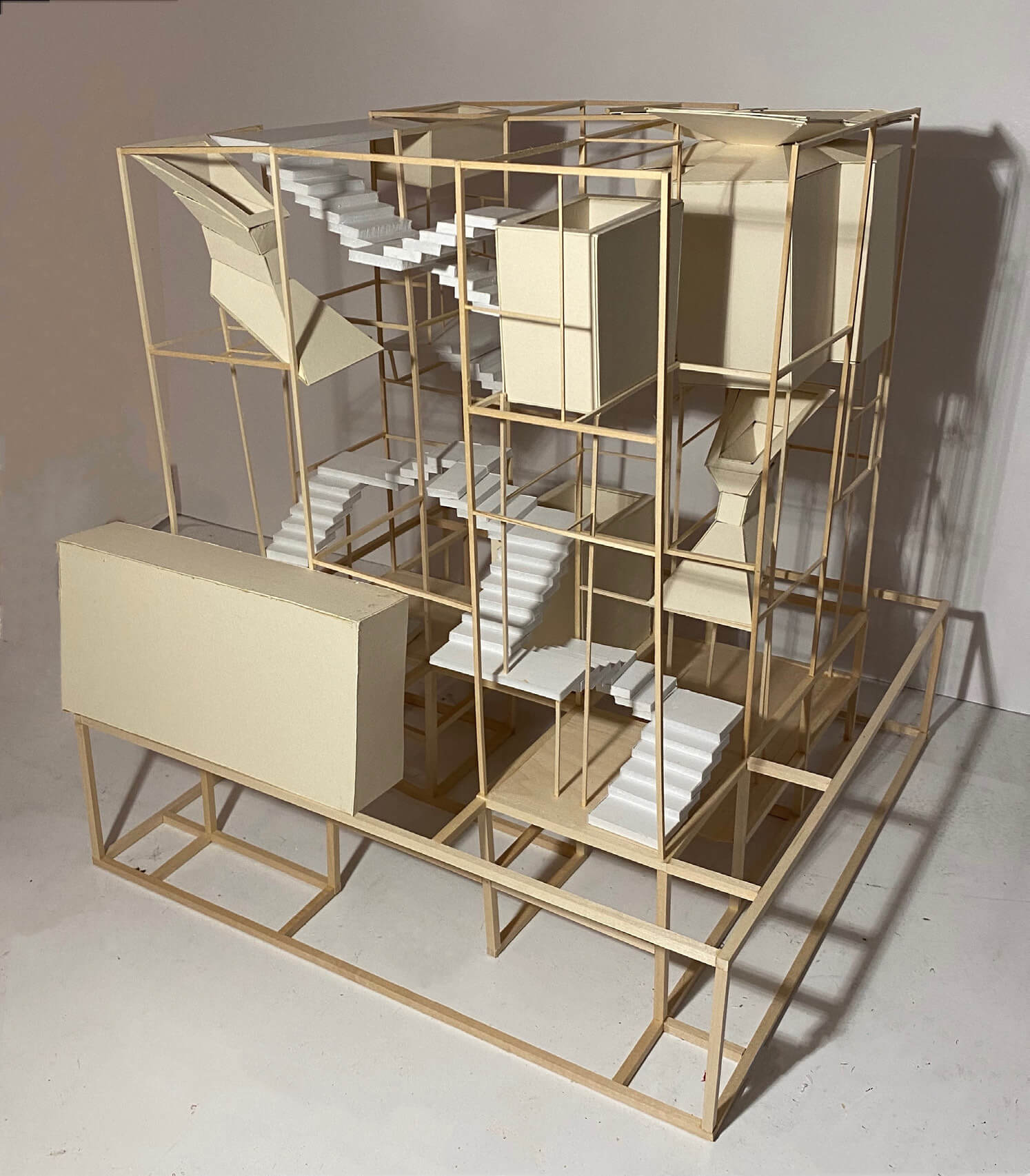 A computer render of an abstract architectural design with few walls and intricate staircases made out of wood.