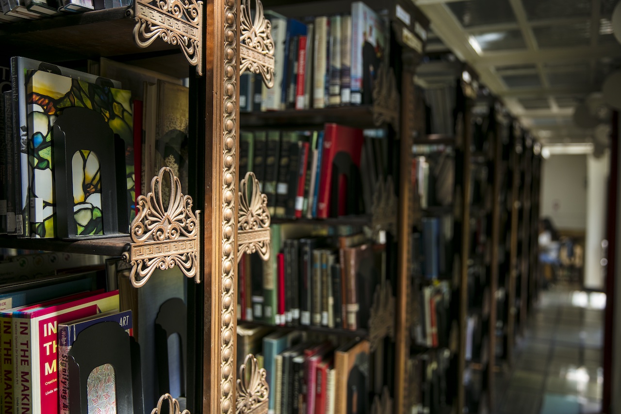 shelves in pratt library, filled with books both current and historic
