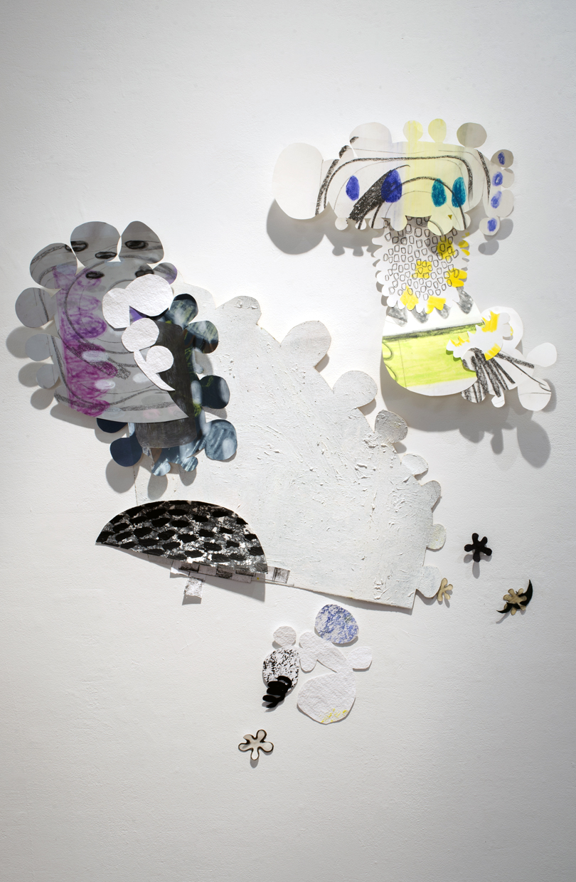 Abstract shaped paper on a wall