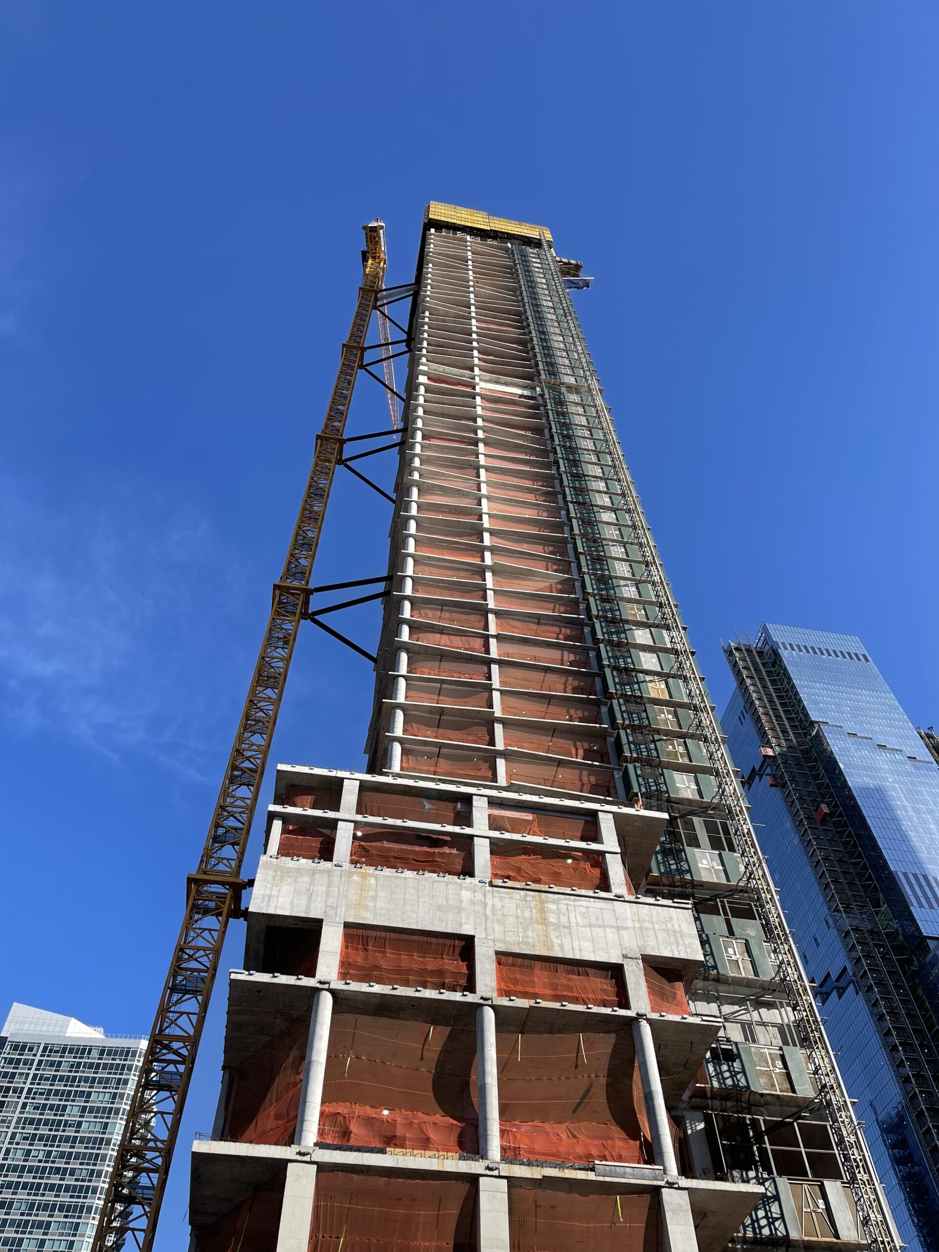 A photograph of a skyscraper under construction.
