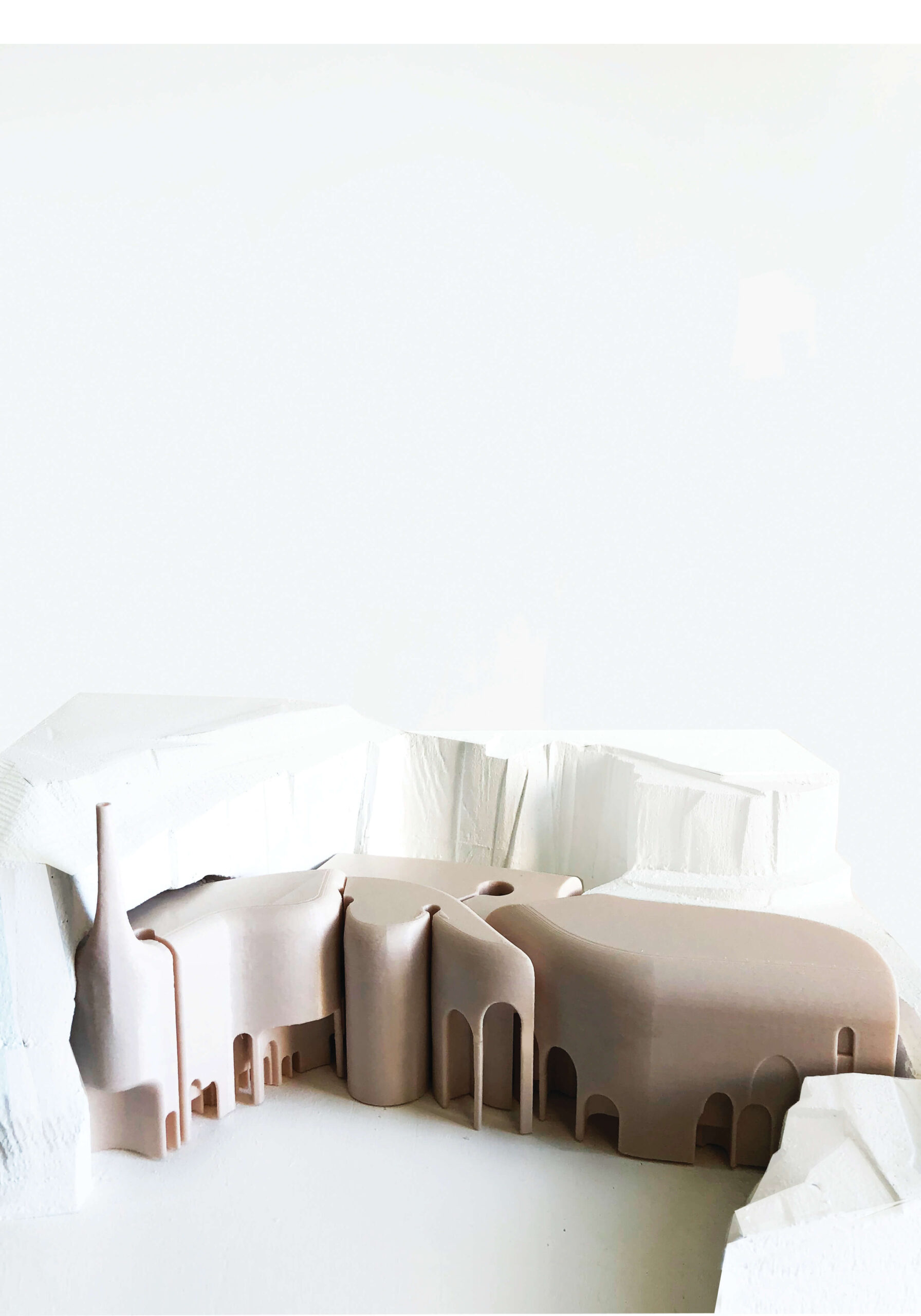 An amorphous white and beige model set against a white background.