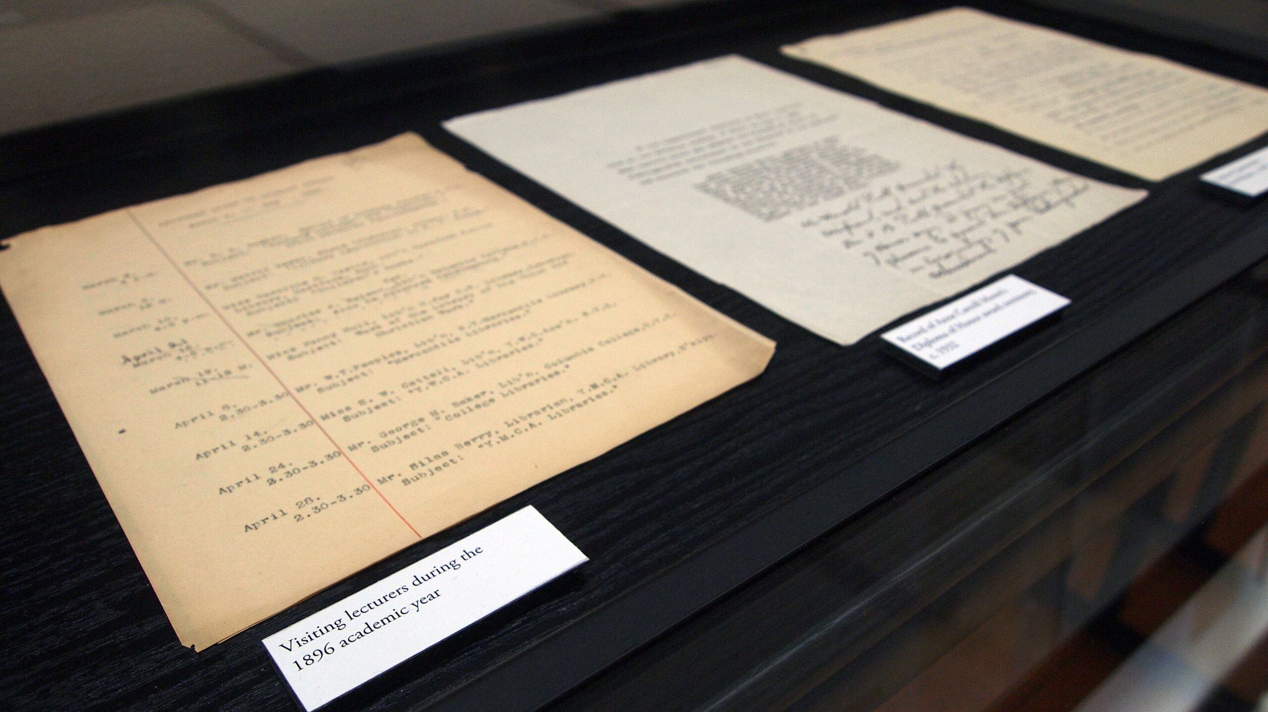 archival papers on display in gallery