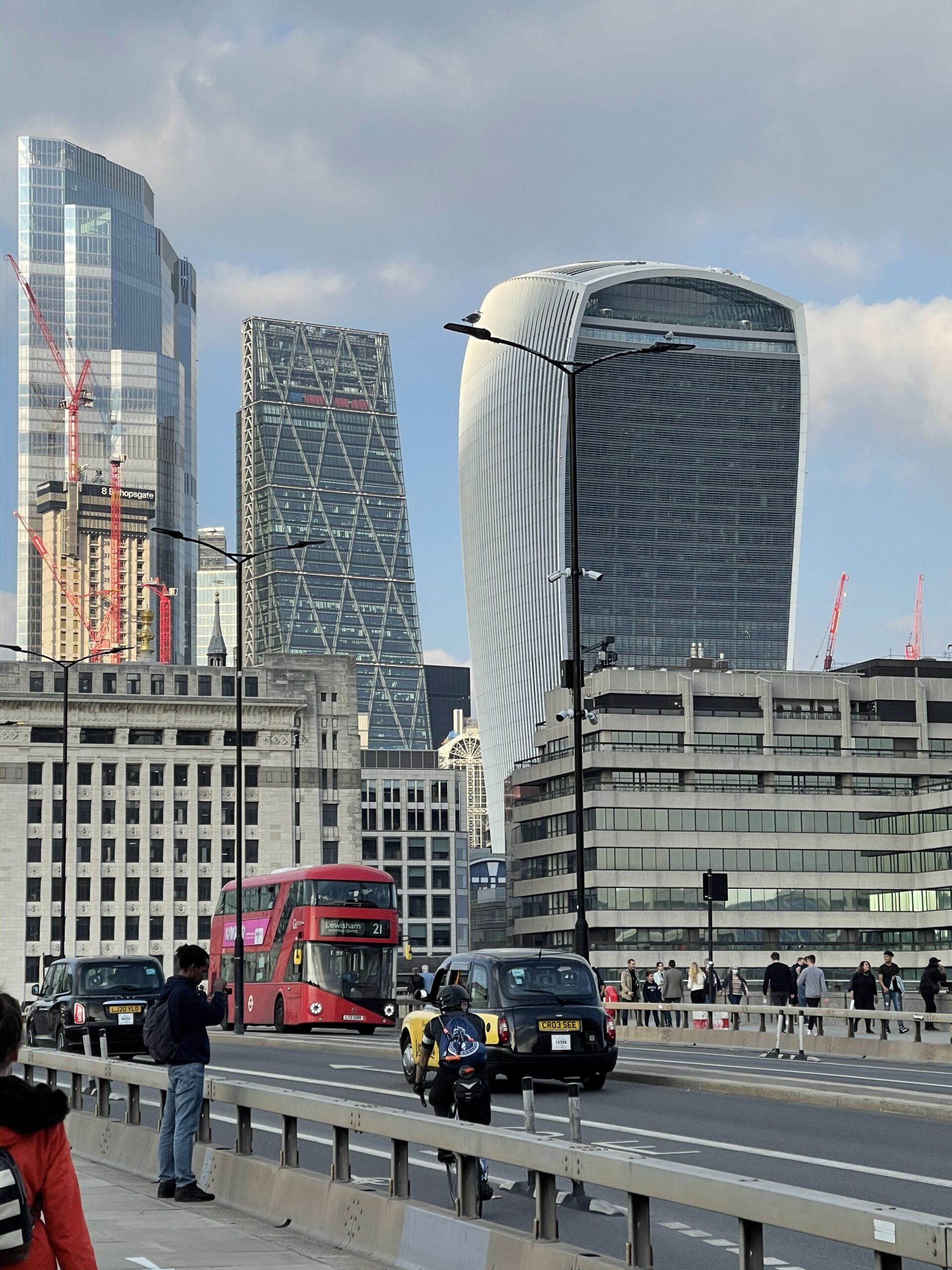 London skyline with red double-decker bus.