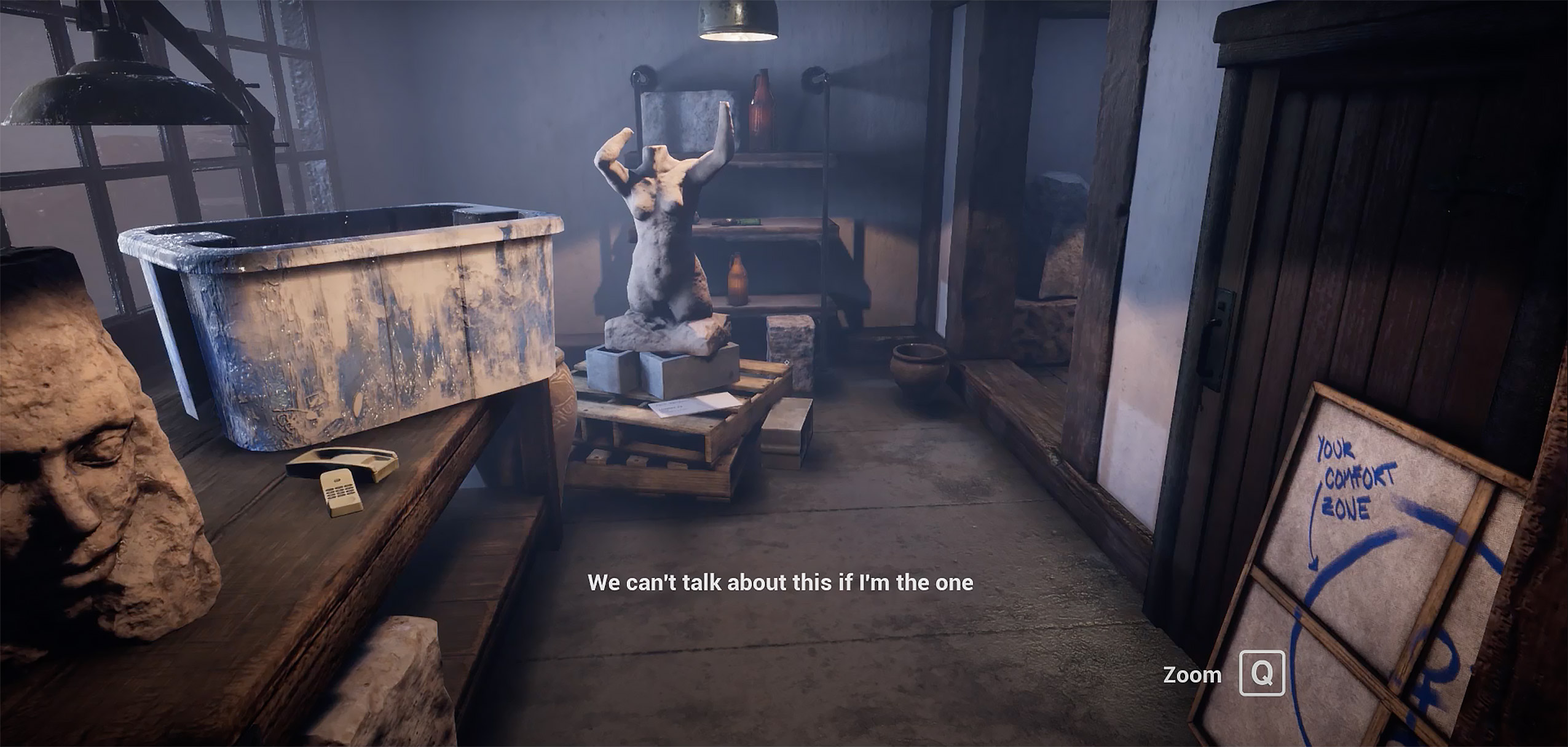 image of a dimly lit studio with multiple unfinished sculptures