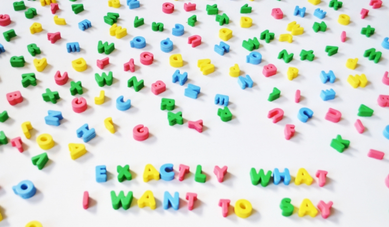 An assortment of colorful alphabet pieces, with the words 