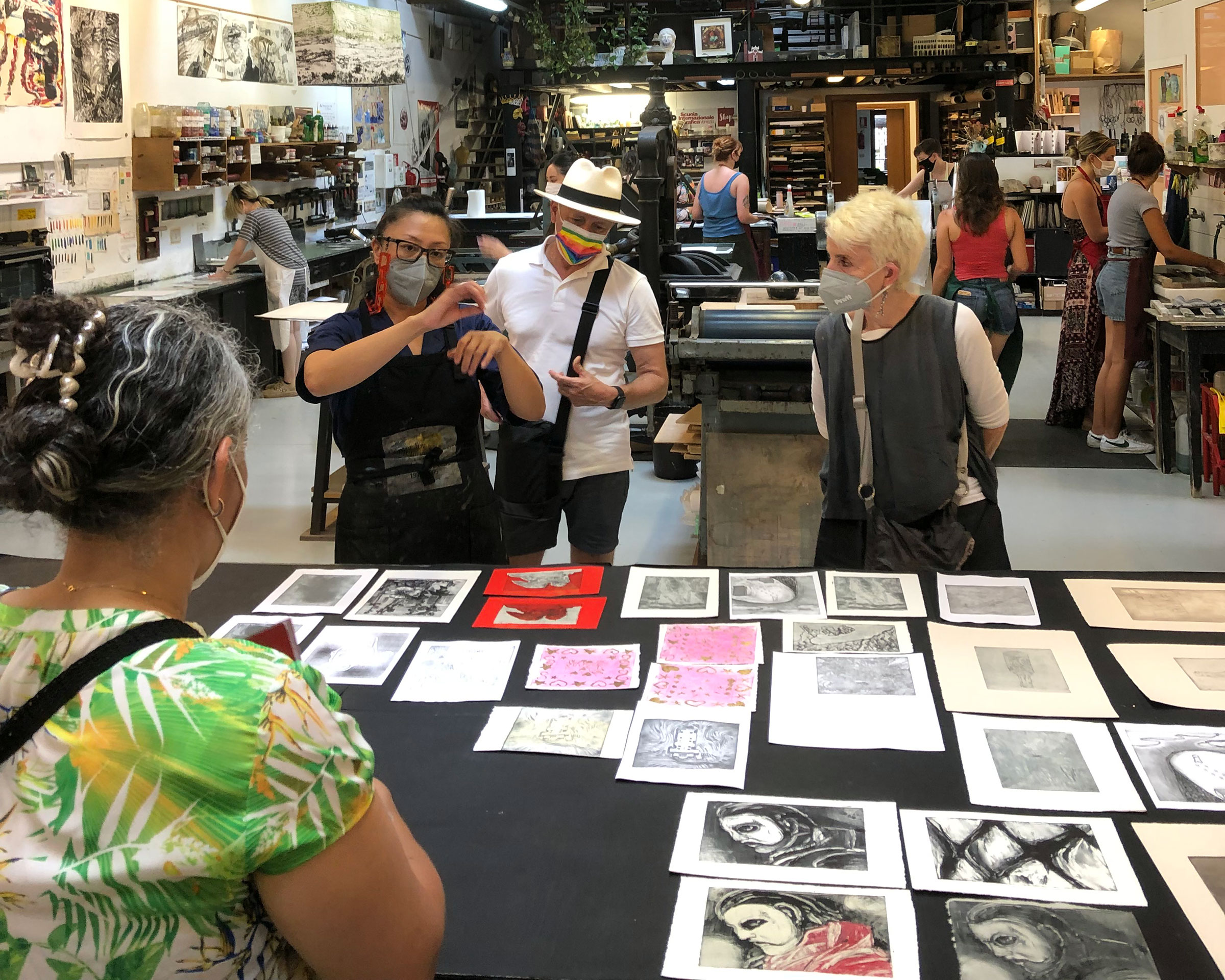 Pratt President Frances Bronet and School of Art Dean Jorge Oliver listen to Visiting Assistant Professor Fay Ku discuss the printmaking students’ projects at the Scuola Internazionale di Grafica (photo by Joseph Kopta)