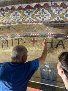 Mosaic restorer Giovanni Cucco explains his work at SS. Maria e Donato to graduate student Amy Ungricht (photograph by Kate McElhiney)