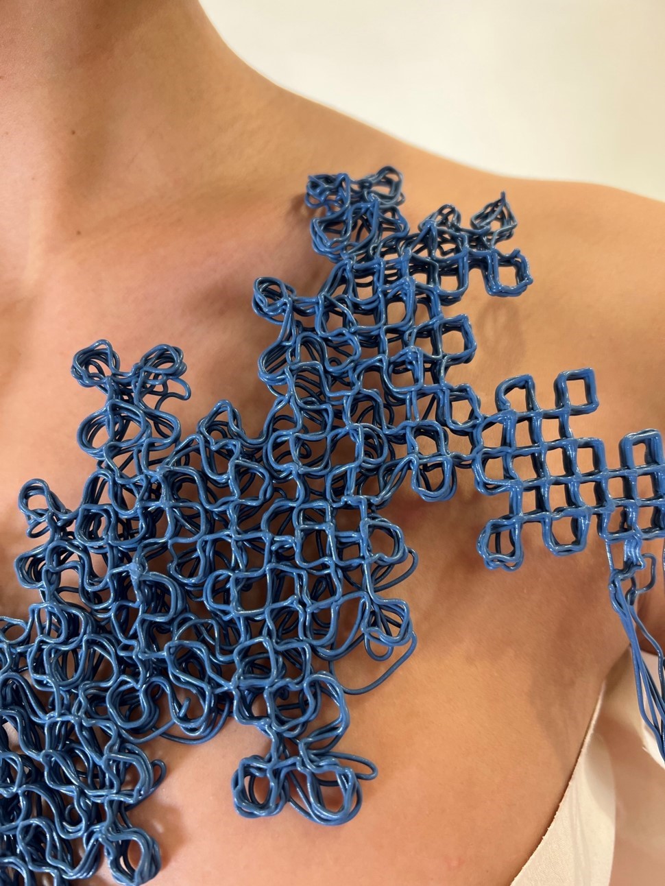 close up view of pellet "fabric" on directly on a model's body.