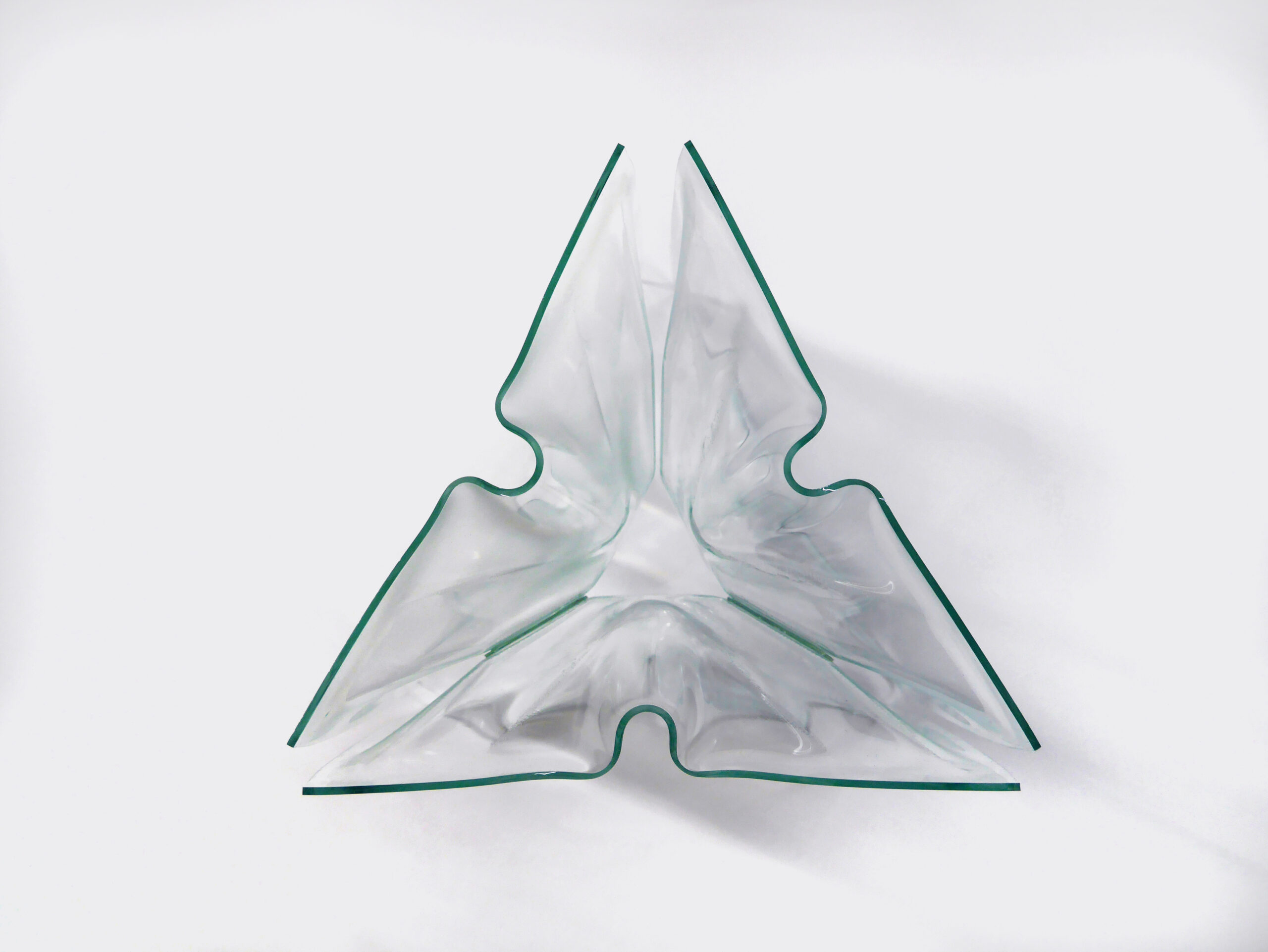 three formed glass sheets situated to form a triangle