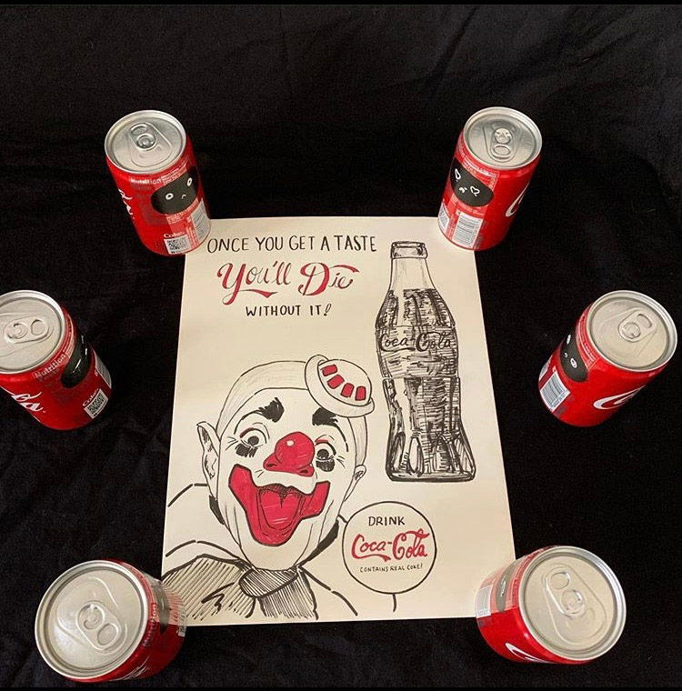 Sculpture of coca cola cans around centered drawing of clown