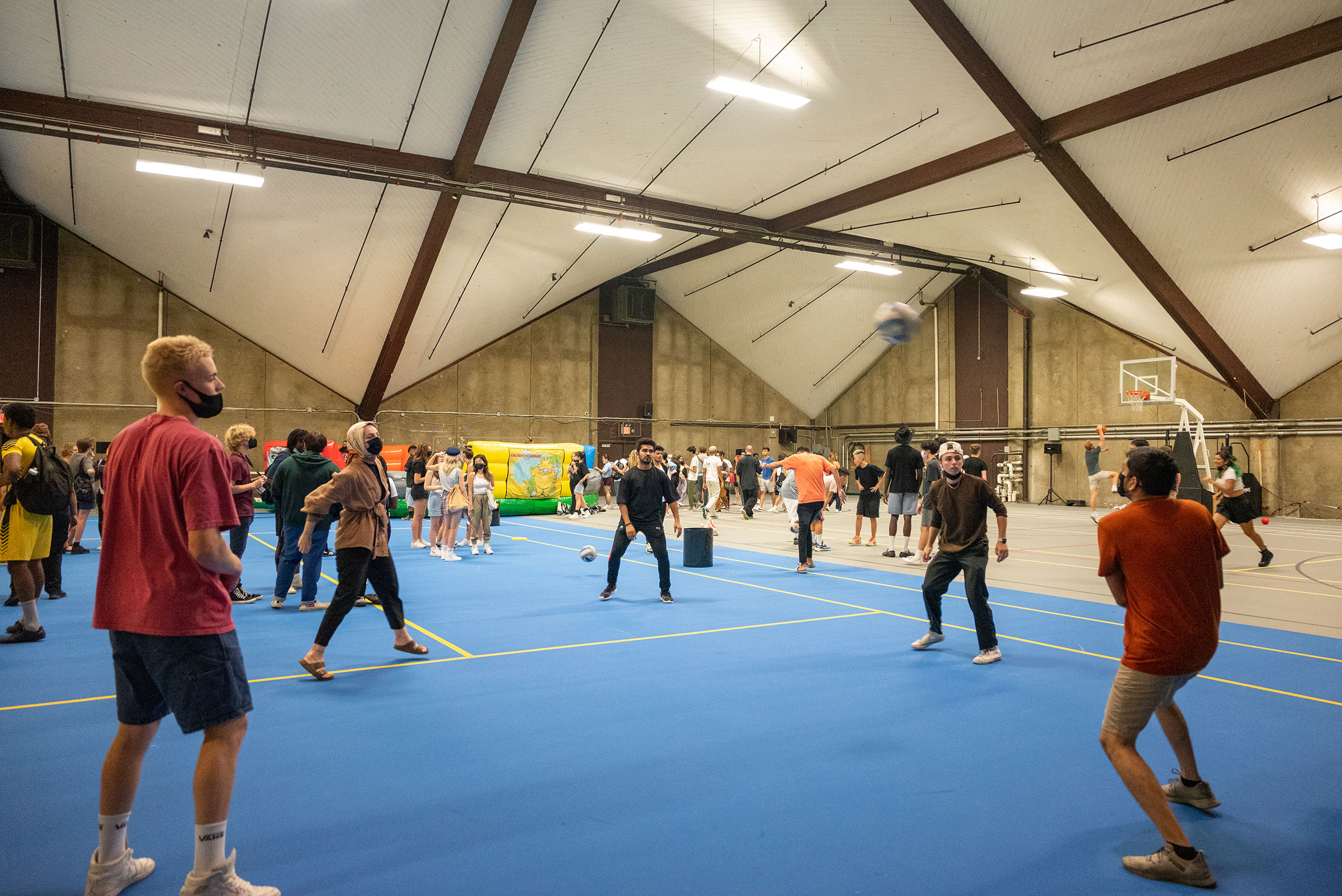 students playing volleyball in the recreational center.