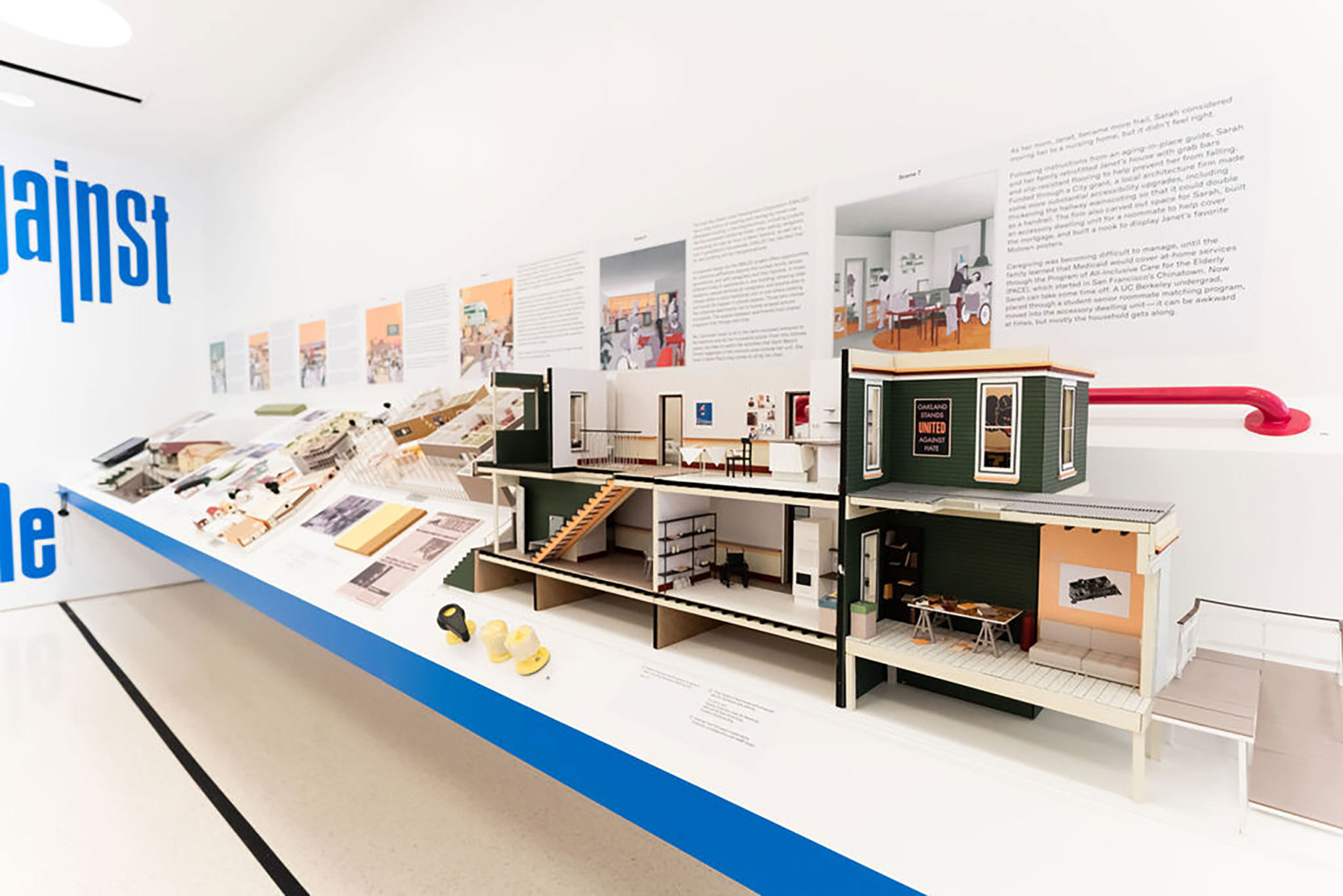 A photo of an architecture presentation with scaled down models of various architectural designs on display.
