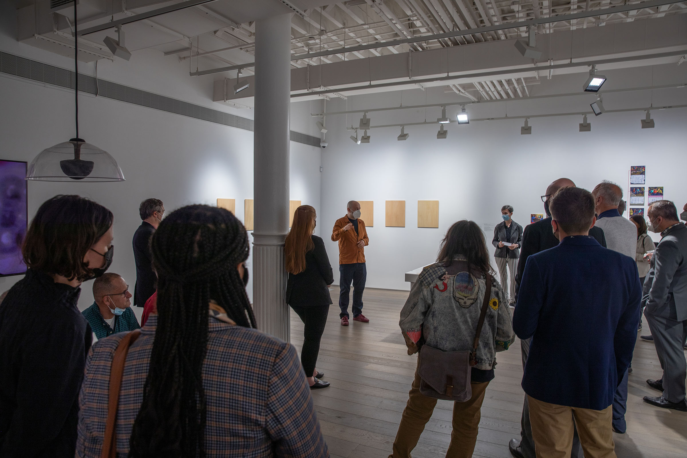 People looking at a speaker