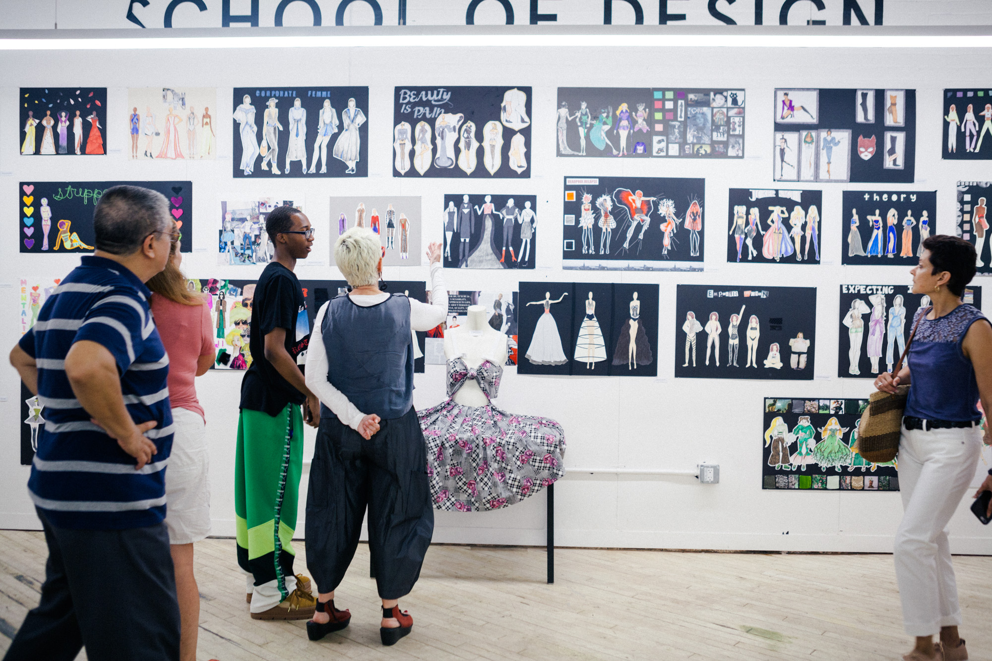 President Bronet talking to students at a fashion critique