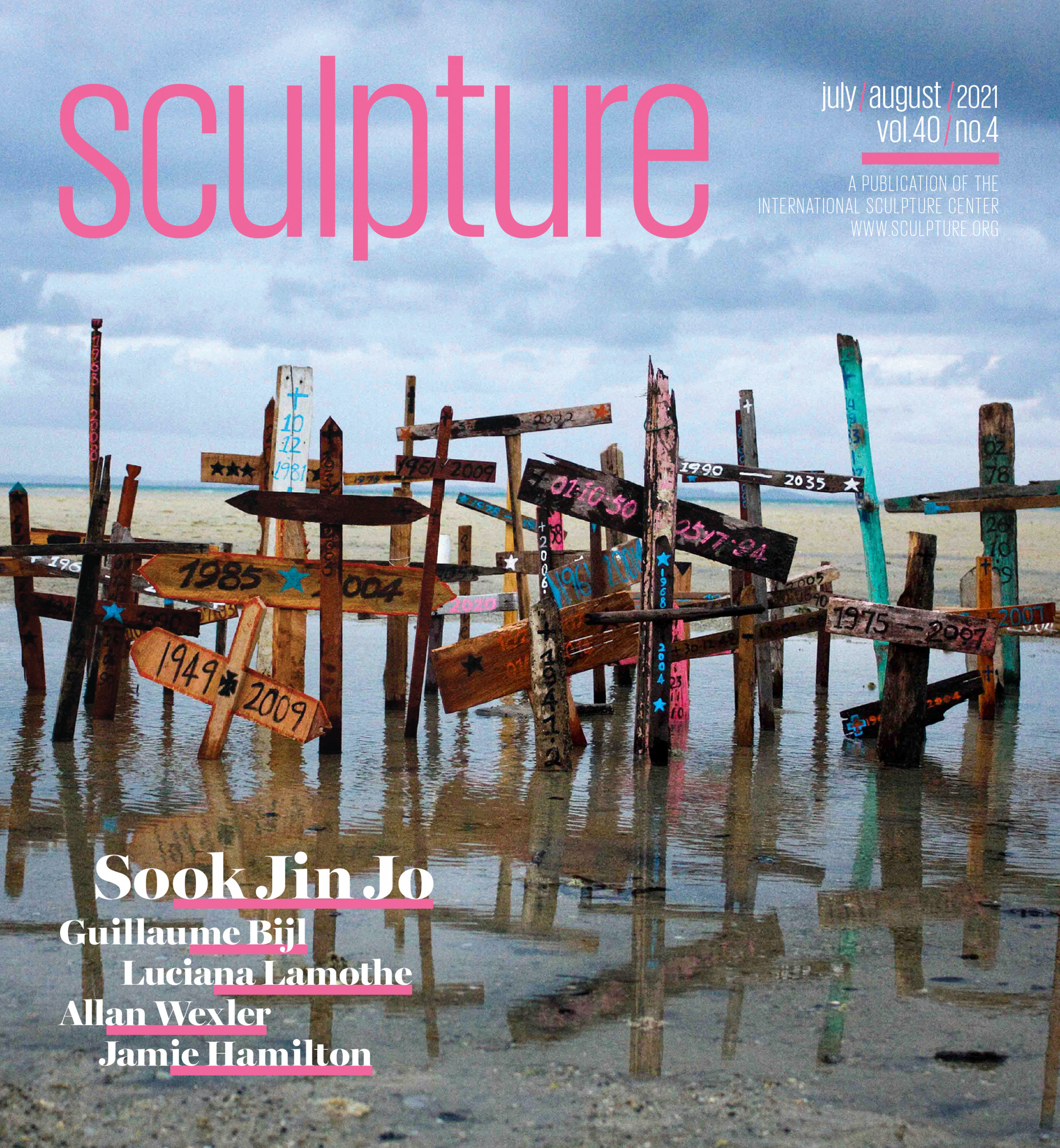 Cover of Sculpture magazine featuring installation of handmade wooden cross grave markers planted along shoreline waters