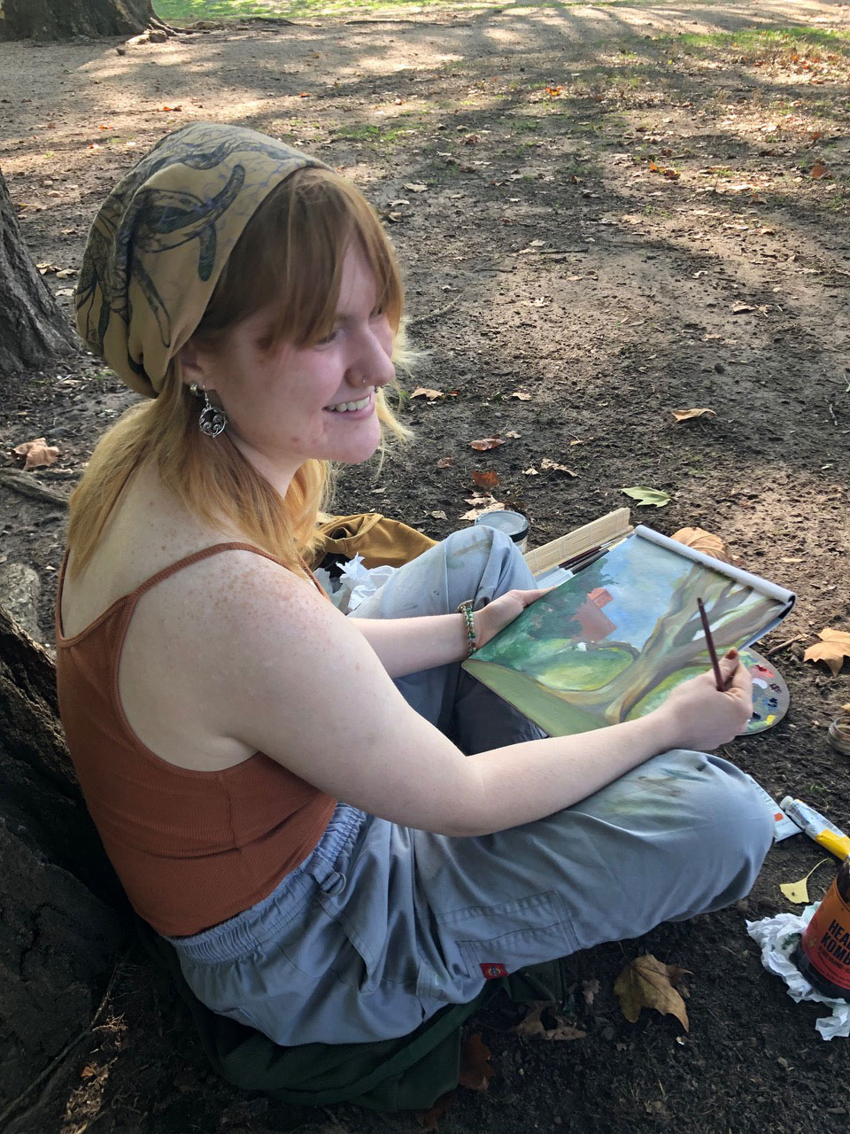 A person holding a painting