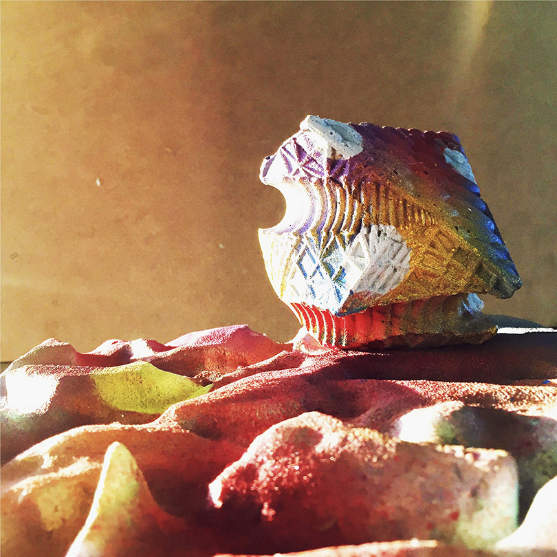 Render of a rock-like structure in a desert-like environment