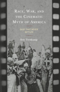 Book cover with text reading Race, War, and the Cinematic Myth of America above film still of white hooded figures surrounding actor painted black