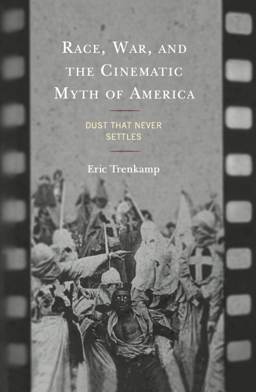 Book cover with text reading Race, War, and the Cinematic Myth of America above film still of white hooded figures surrounding actor painted black
