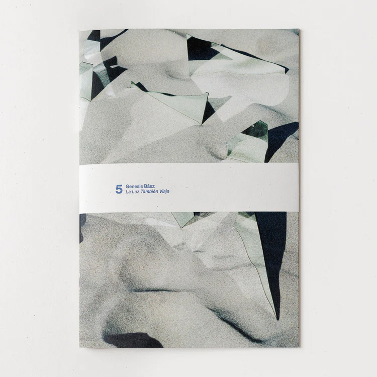 Book with abstract image of expanse of paper or fabric with triangular sections cut and pulled back