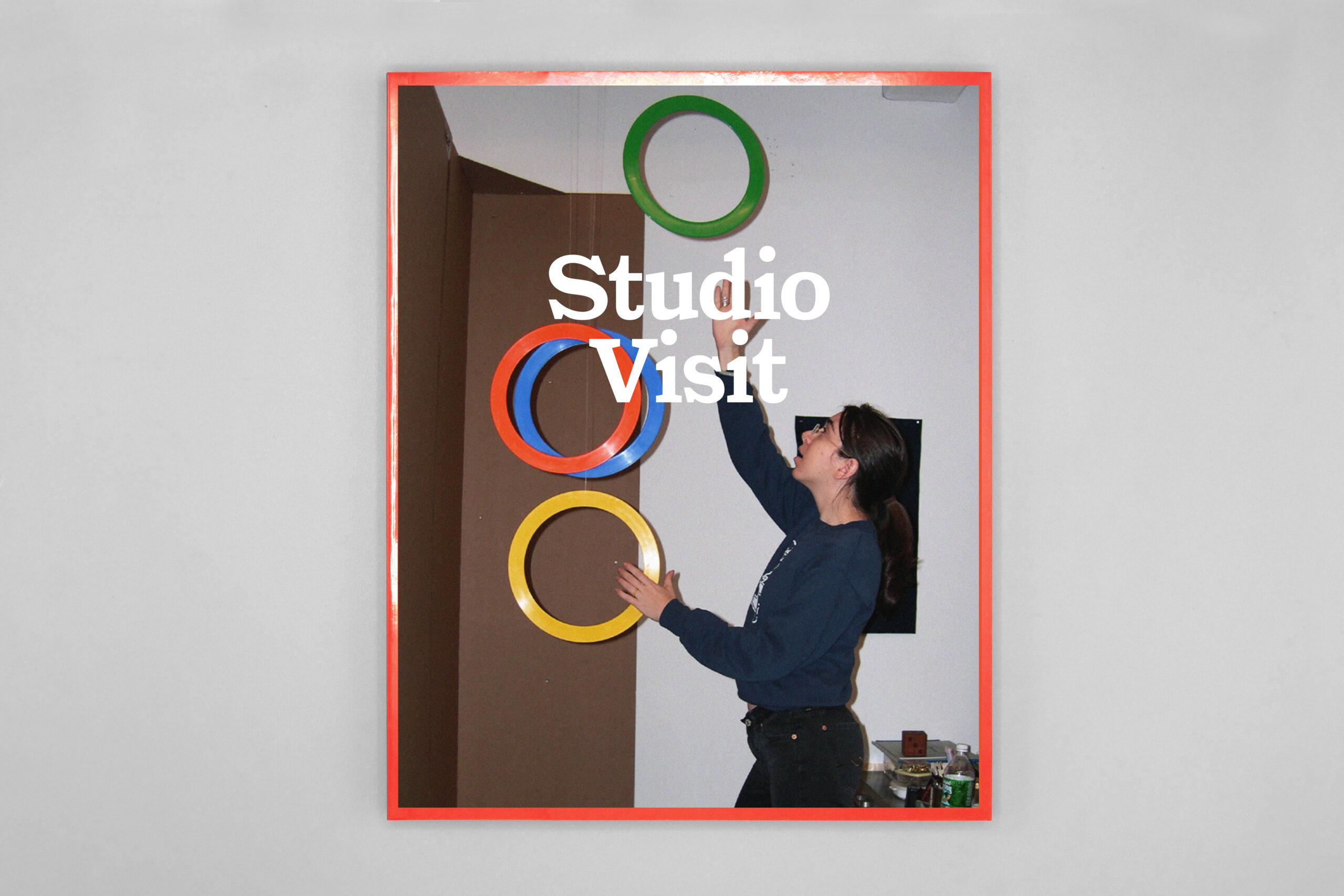 Book with photo of person juggling colorful rings and text reading Studio Visit