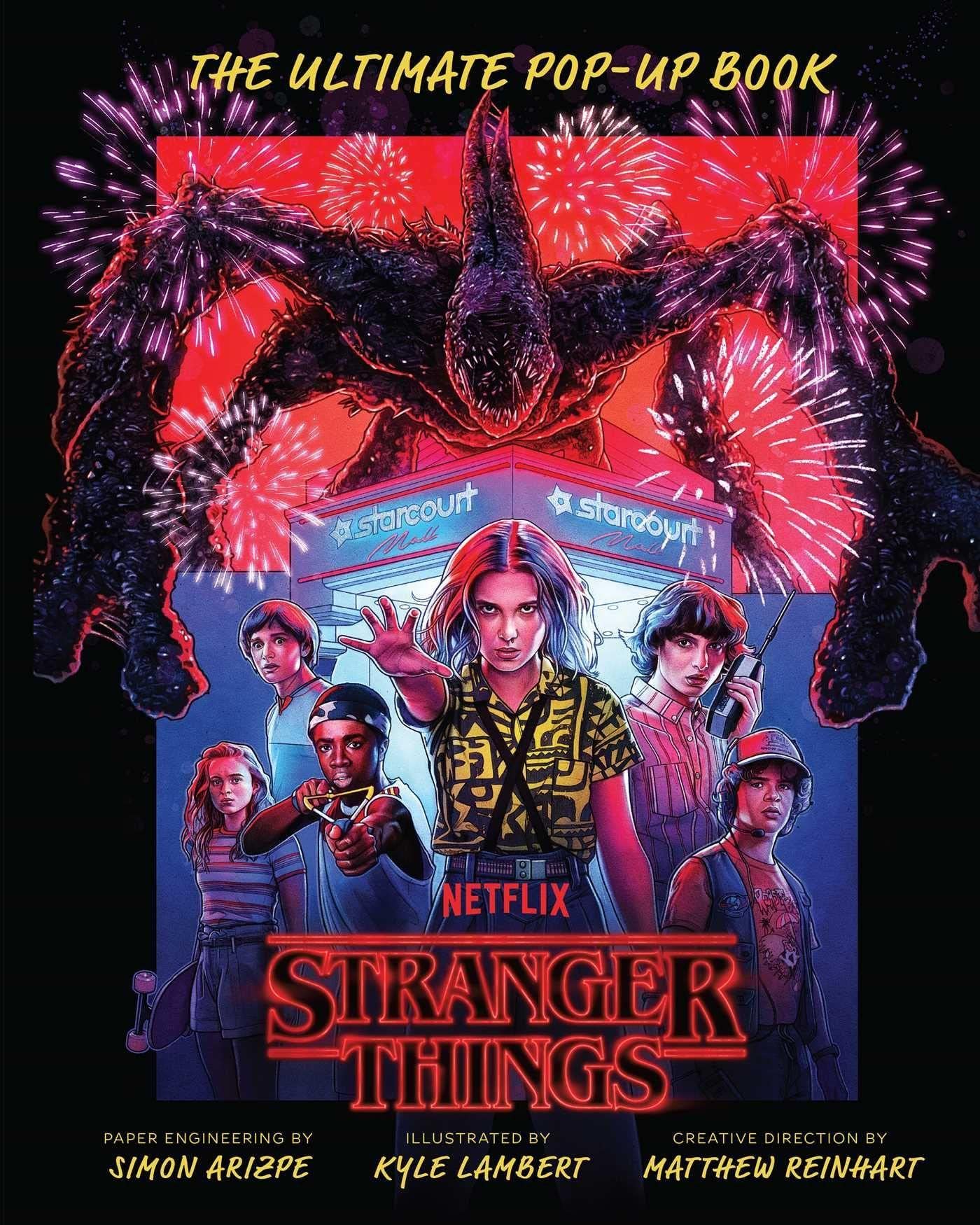 Book cover with text reading Stranger Things The Ultimate Pop Up Book and illustration of young people bracing for battle under menacing creature