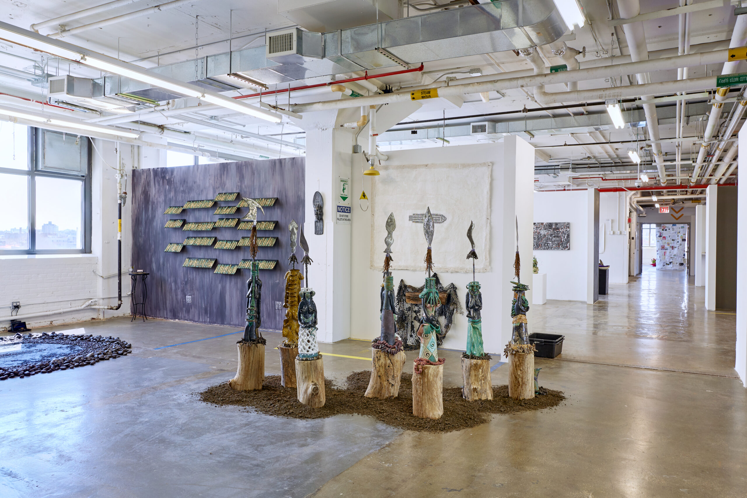 thesis exhibition depicting tribal statue sculpture