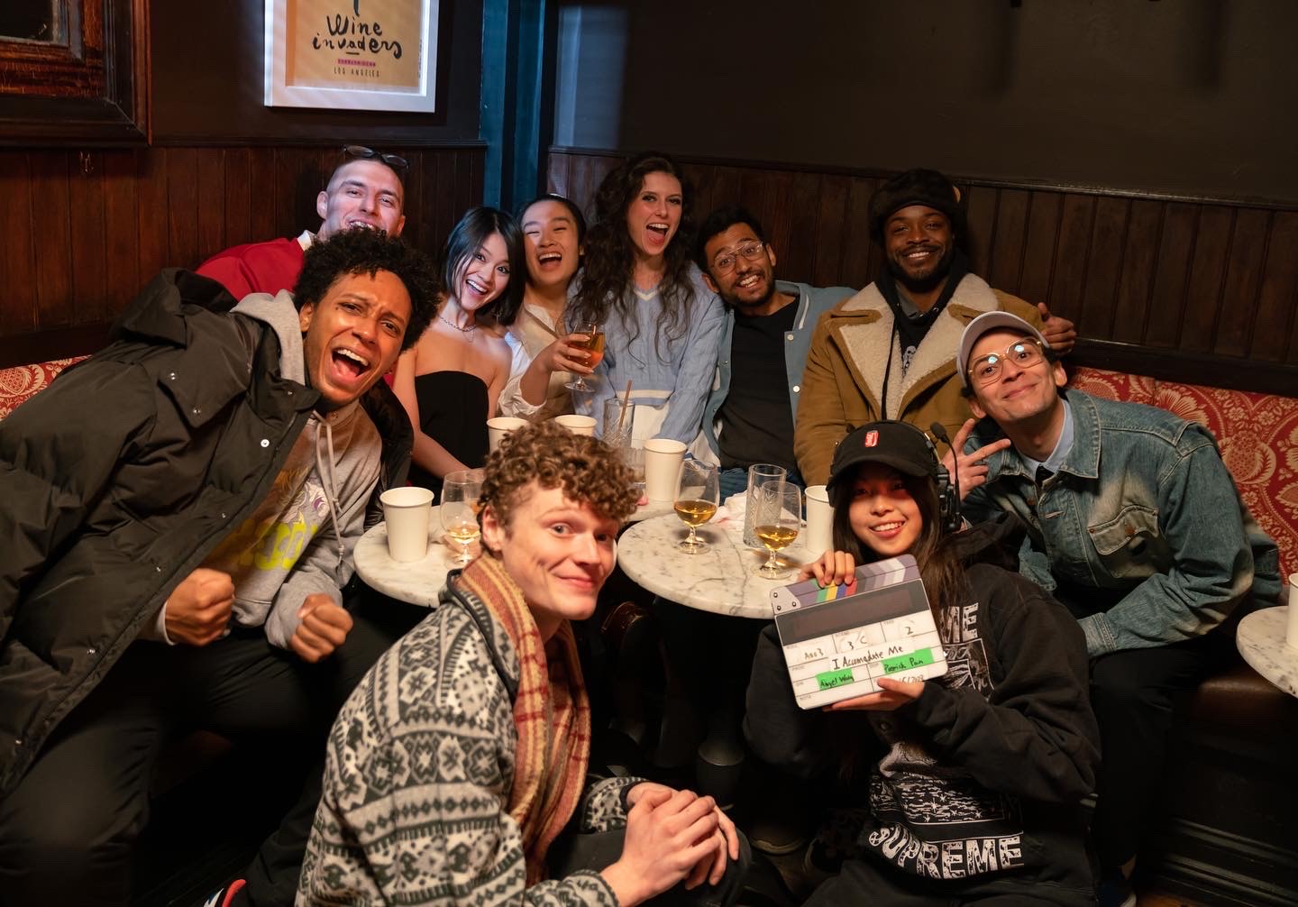a group of students huddled in a photo for a scene