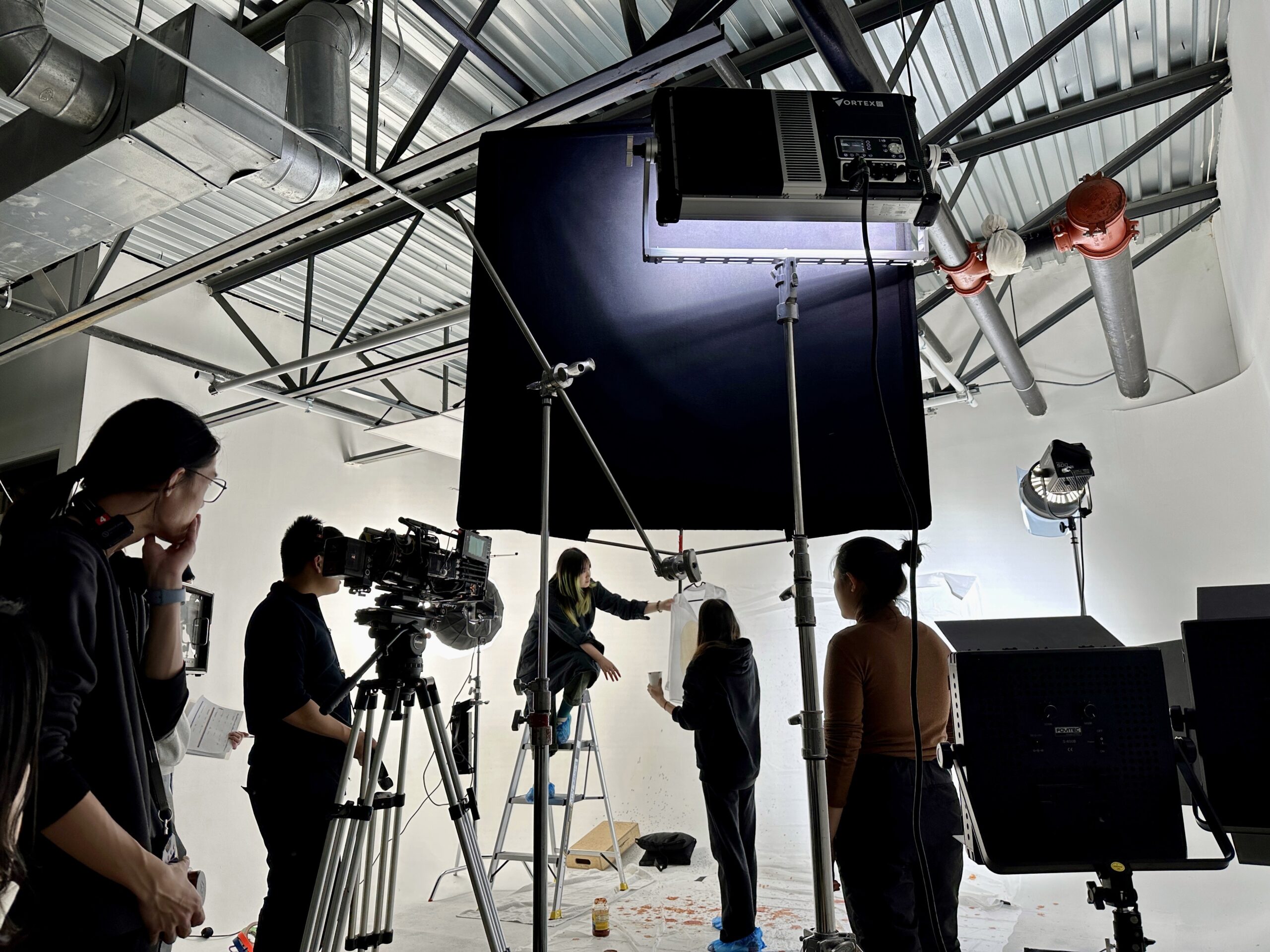 a group of students preparing for a photoshoot