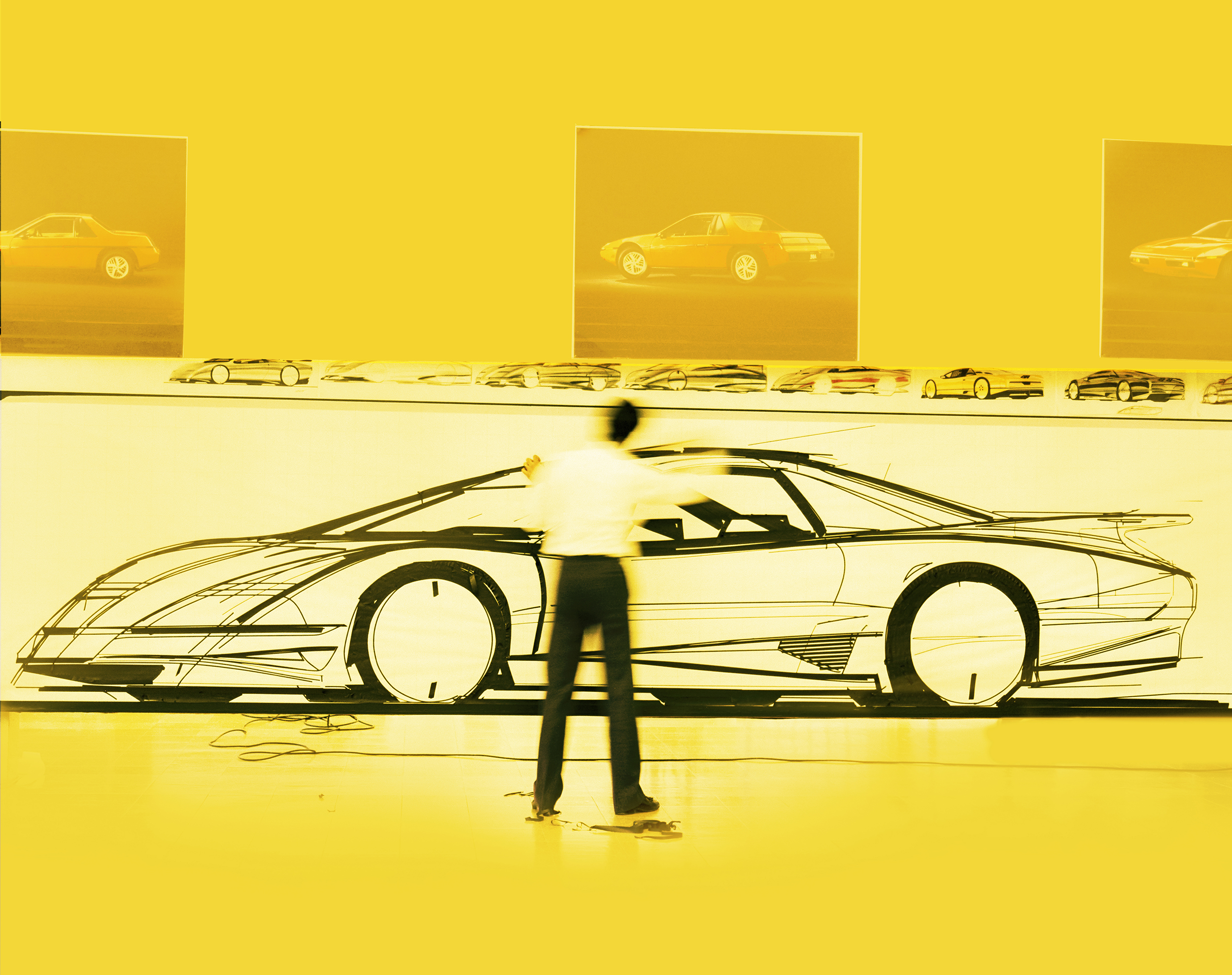 a picture of a car with a man standing in front of it
