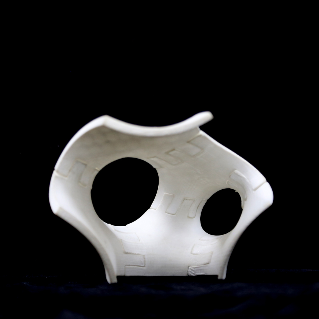 device, resembling armor, or a girdle with interlocking parts