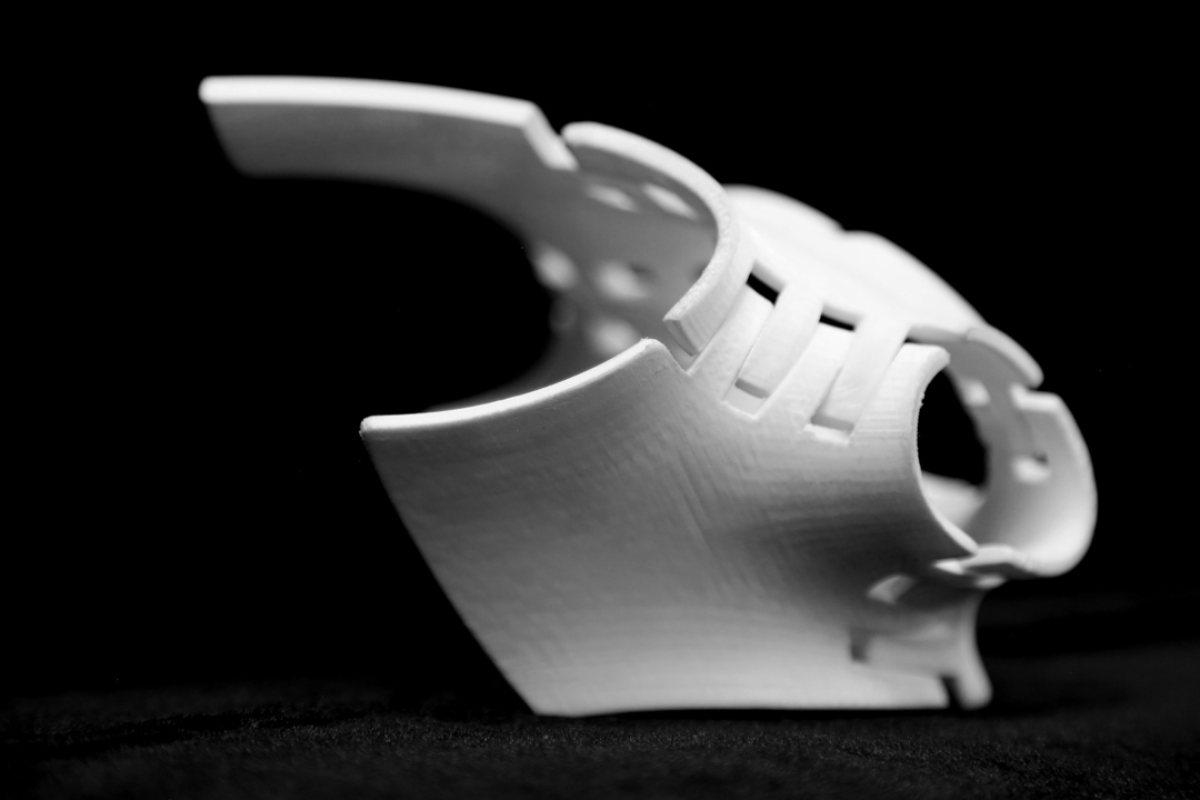 device, resembling armor, or a girdle with interlocking parts