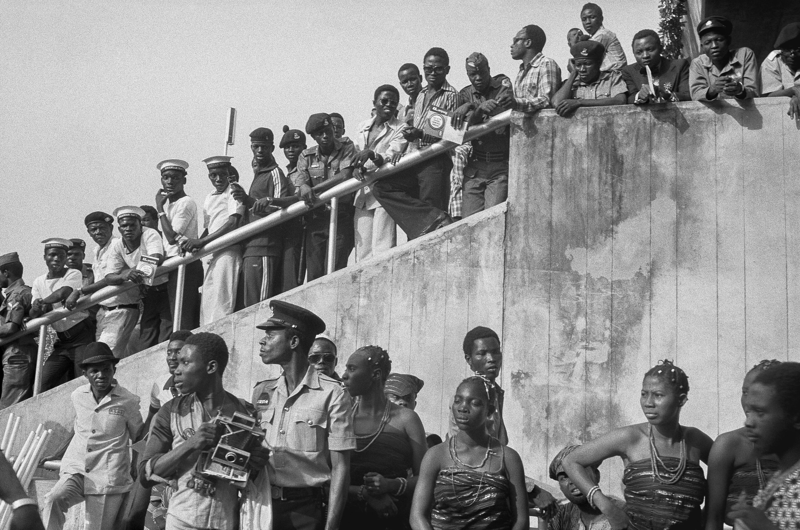 People gathered on various levels of a stadium