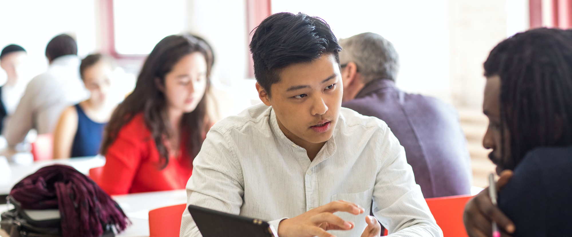 A student in conversation with a person