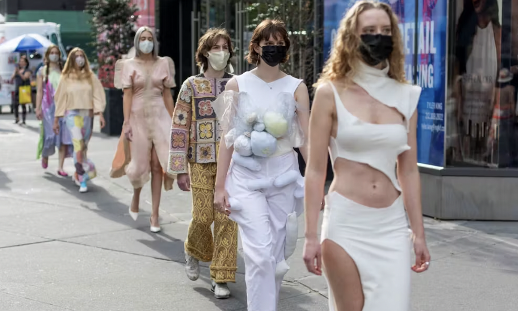 Models walking down a runway.