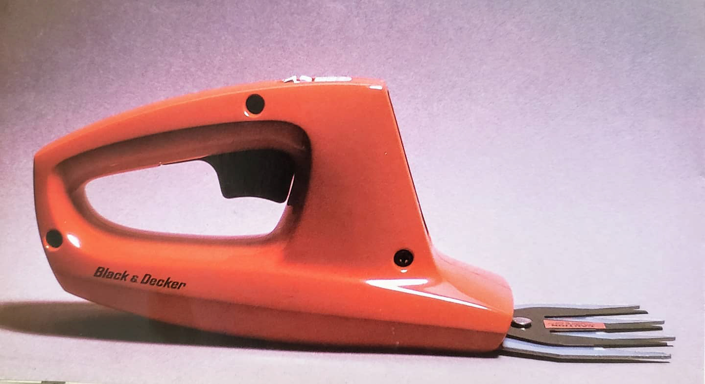 orange plastic shears with a metal blade and black trigger