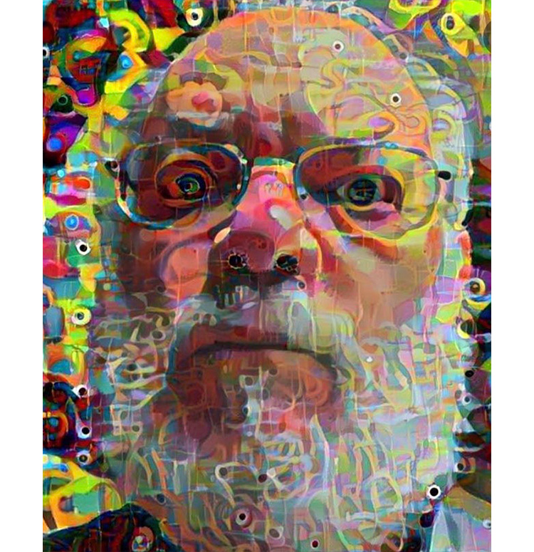 The face of a man with a white beard and glasses, colorfully abstracted and distorted.