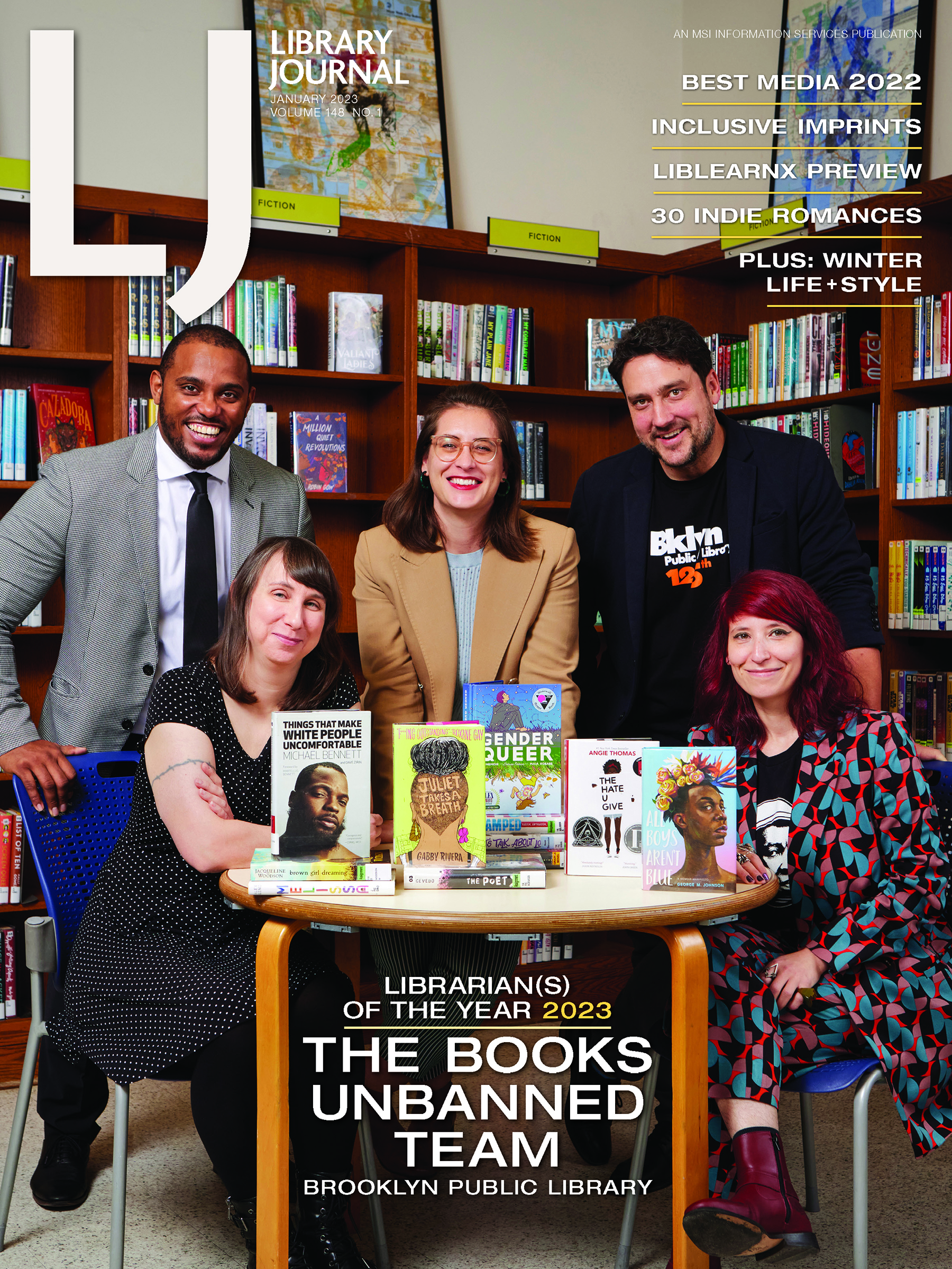 A magazine cover featuring a photo of five people in a library, standing around a table displaying books.