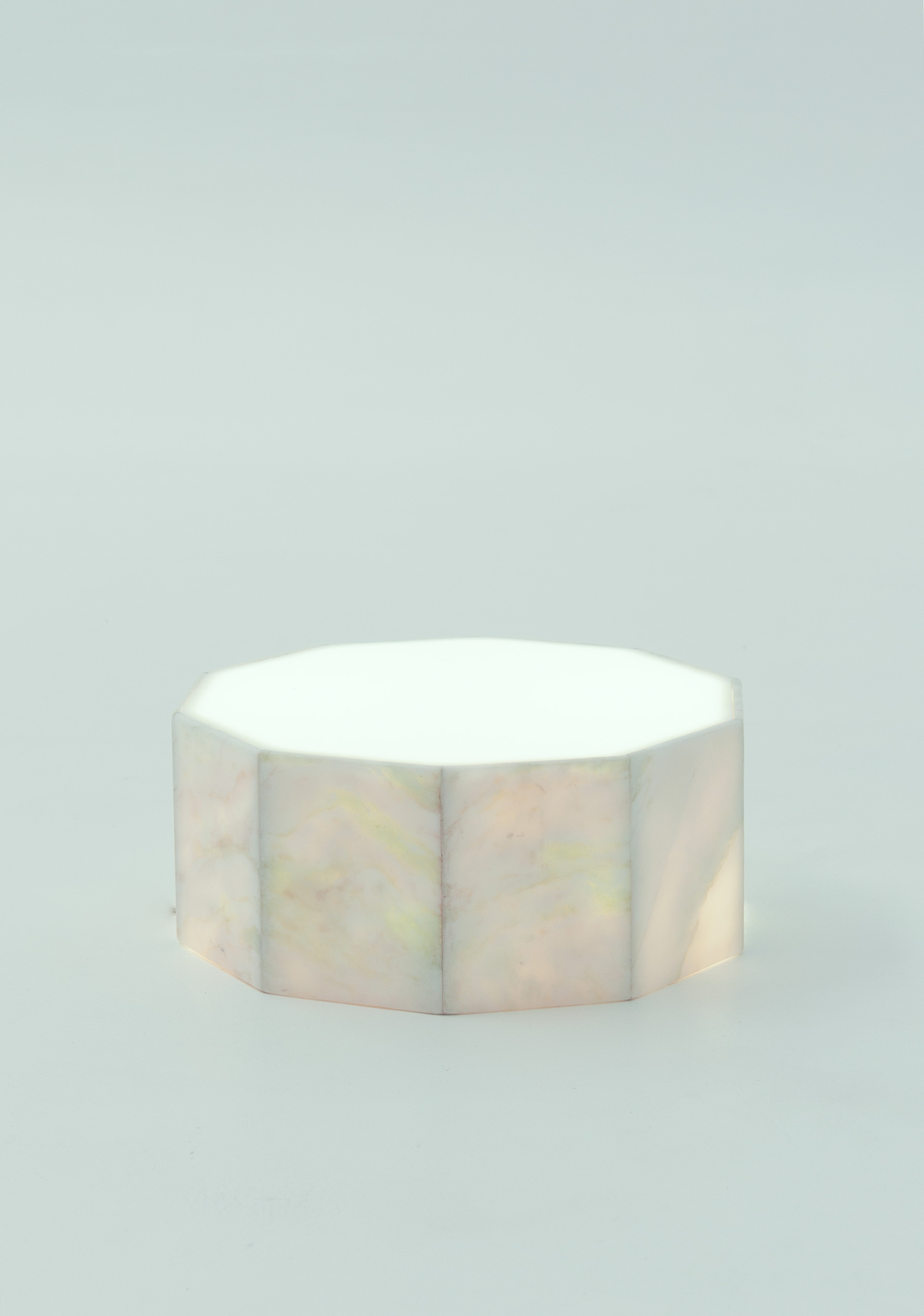 A white ten-sided cushion-like lamp.