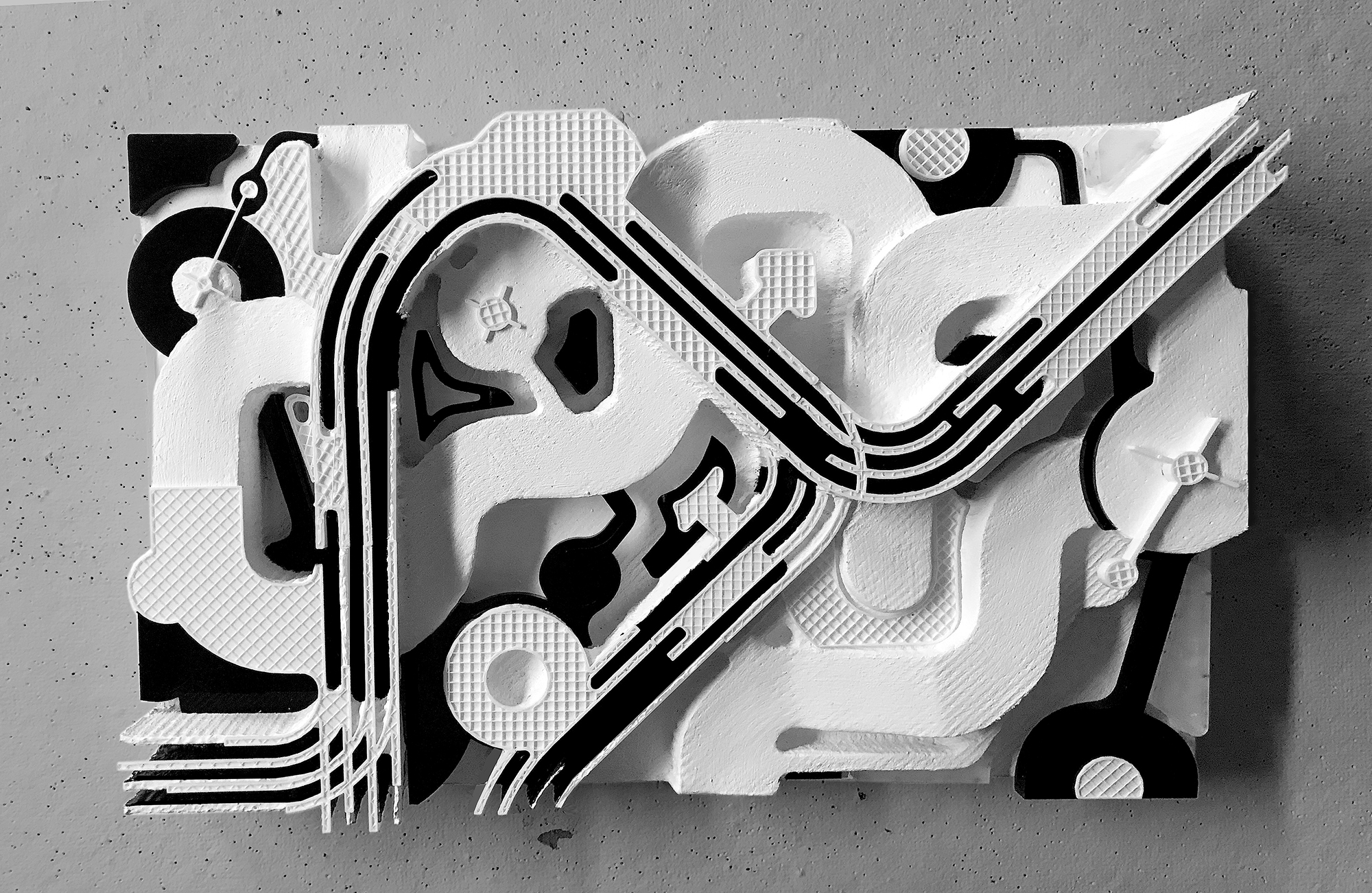 physical architectural model, resembles aerial view of train set